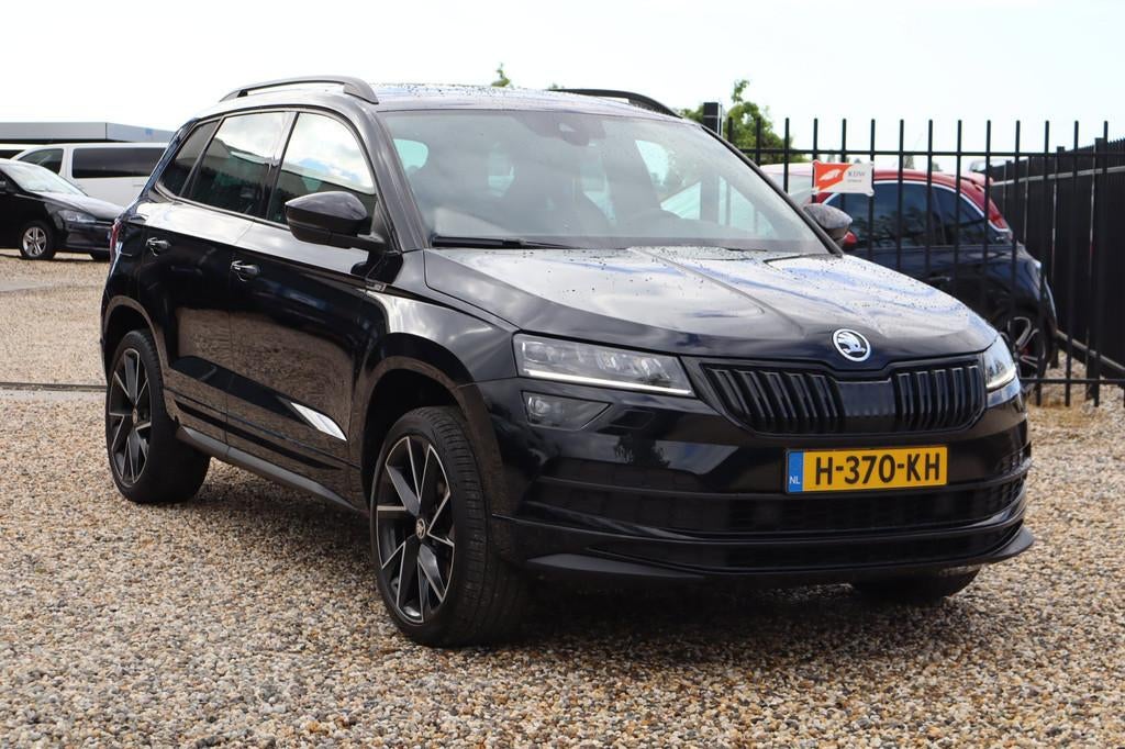 Skoda Karoq 1.5 TSI ACT Sportline Business, Auto's, Skoda, Stof, 4 cilinders, 150 pk, Zwart