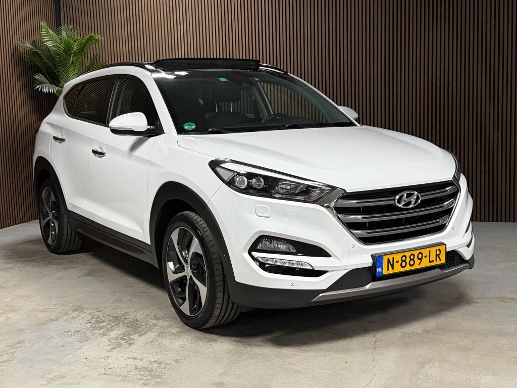 Hyundai Tucson 1.6 T-GDi Prem. 4WD (bj 2016, automaat), Gebruikt, 4 cilinders, Wit, Leder