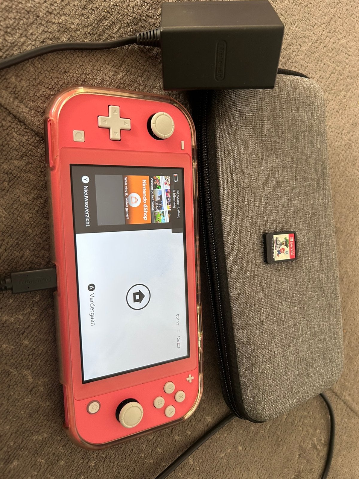 Zeer nette nintendo switch lite, Ophalen of Verzenden, Roze of Coral, Zo goed als nieuw, Met beschermhoes of tas