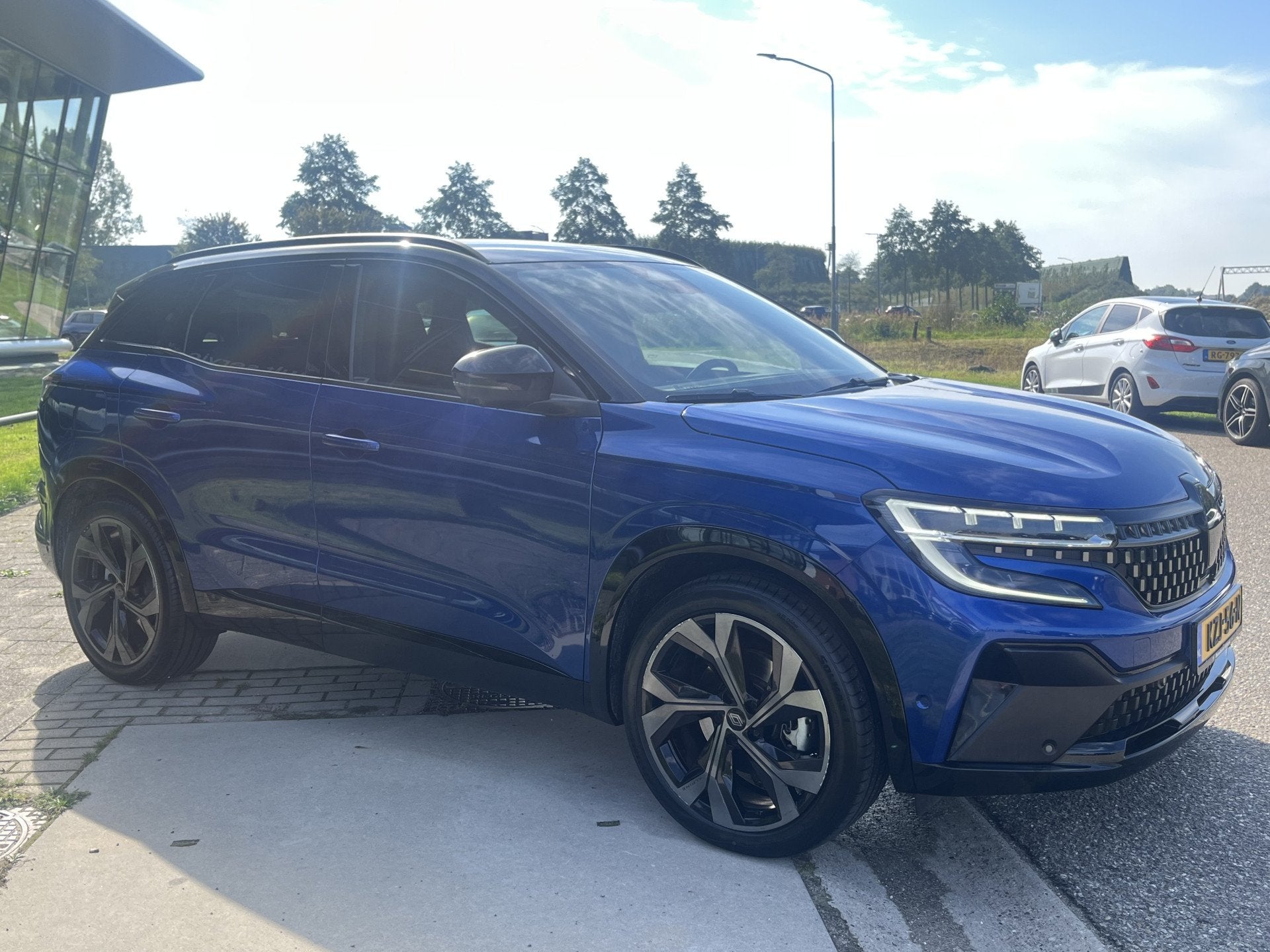 Renault Austral 1.2 E-Tech full hybrid 200PK iconic esprit A, Gebruikt, 1199 cc, Blauw, 1492 kg