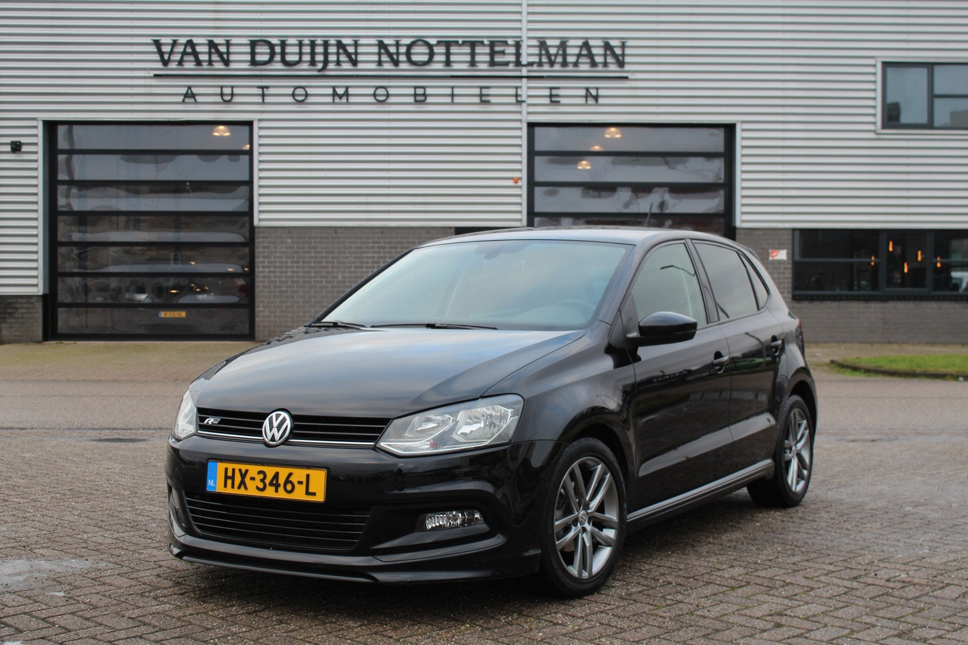 Volkswagen Polo 1.2 TSI Edition R / Navigatie / Clima / N.A., Stof, 4 cilinders, Met garantie (alle), Zwart