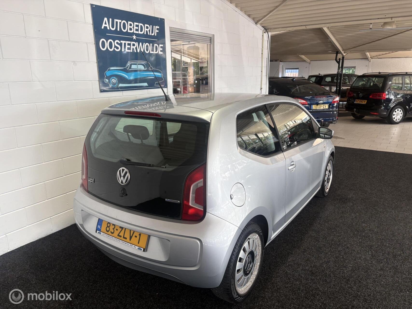 Volkswagen Up! 1.0 High up! Airco - Navi - Stoelverwarming -, Auto's, Volkswagen, Voorwielaandrijving, Euro 5, Stof, Gebruikt