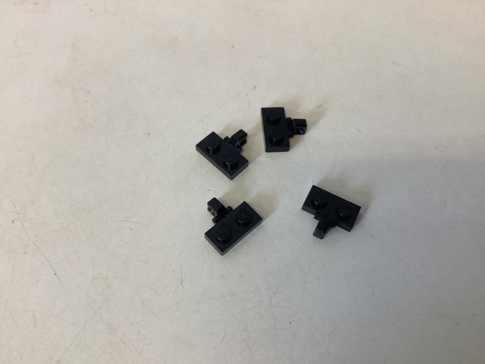 Lego scharnierplaat 1x2 met 1 vinger aan zijkant zwart, Ophalen of Verzenden, Gebruikt, Losse stenen, Lego