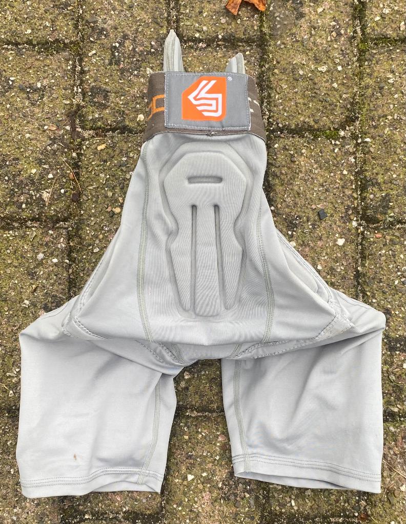 Shock DokterDijbeen bil bescherm broek mt 164, Sport en Fitness, Snowboarden, Ophalen of Verzenden, Zo goed als nieuw, Kleding