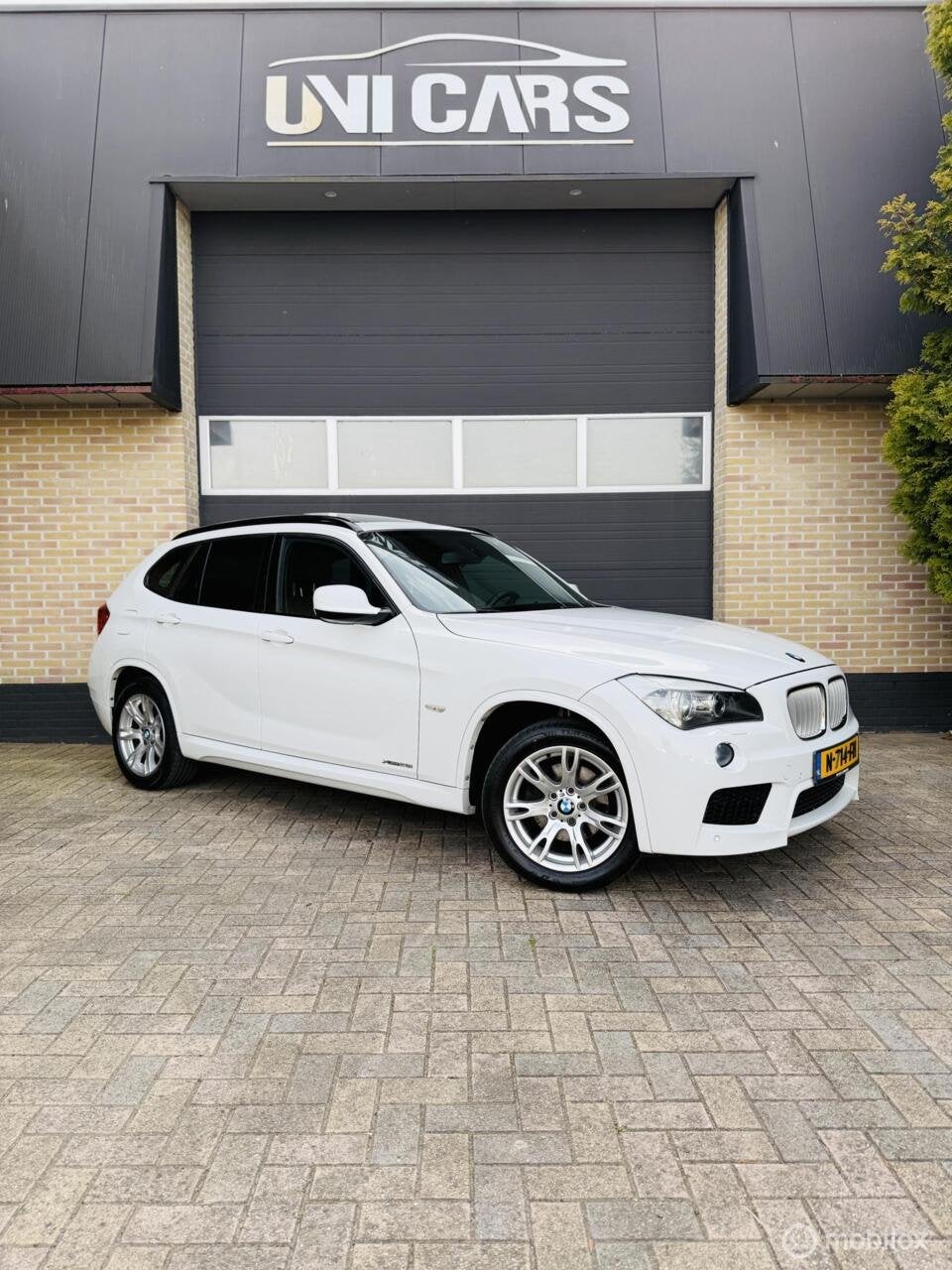 BMW X1 xDrive28i 245PK High Executive|M Sport||Alcantara|Dak, Auto's, Euro 5, Gebruikt, 4 cilinders, 2000 kg
