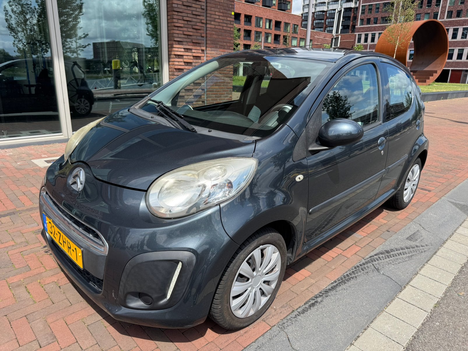 Citroën C1 1.0i 68PK 5D 2012 Grijs Airco, Auto's, Voorwielaandrijving, Stof, Zwart, 4 stoelen