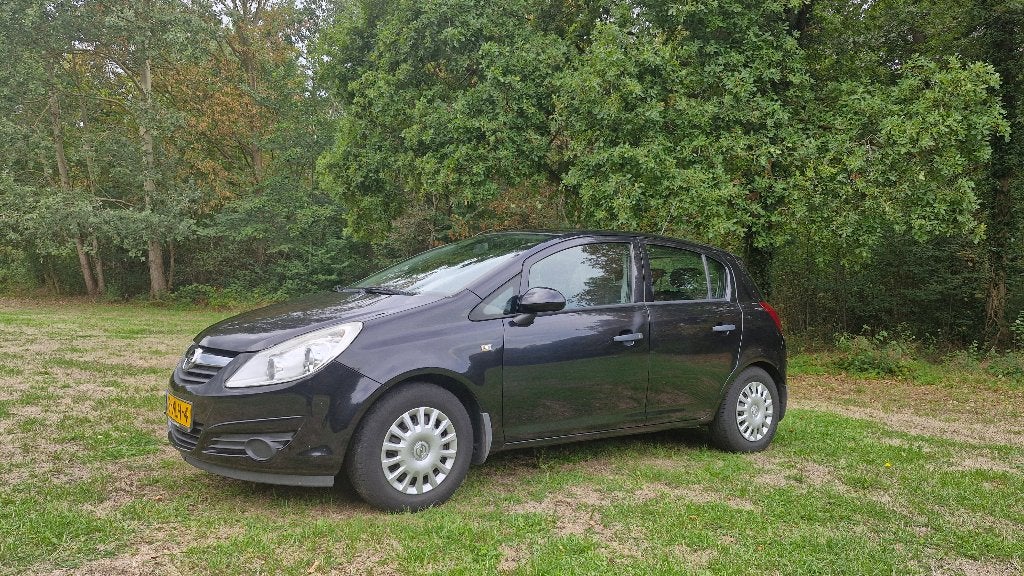 Opel Corsa 1.0 12V 5D 2010 Zwart, Auto's, Voorwielaandrijving, Stof, Zwart, 1045 kg