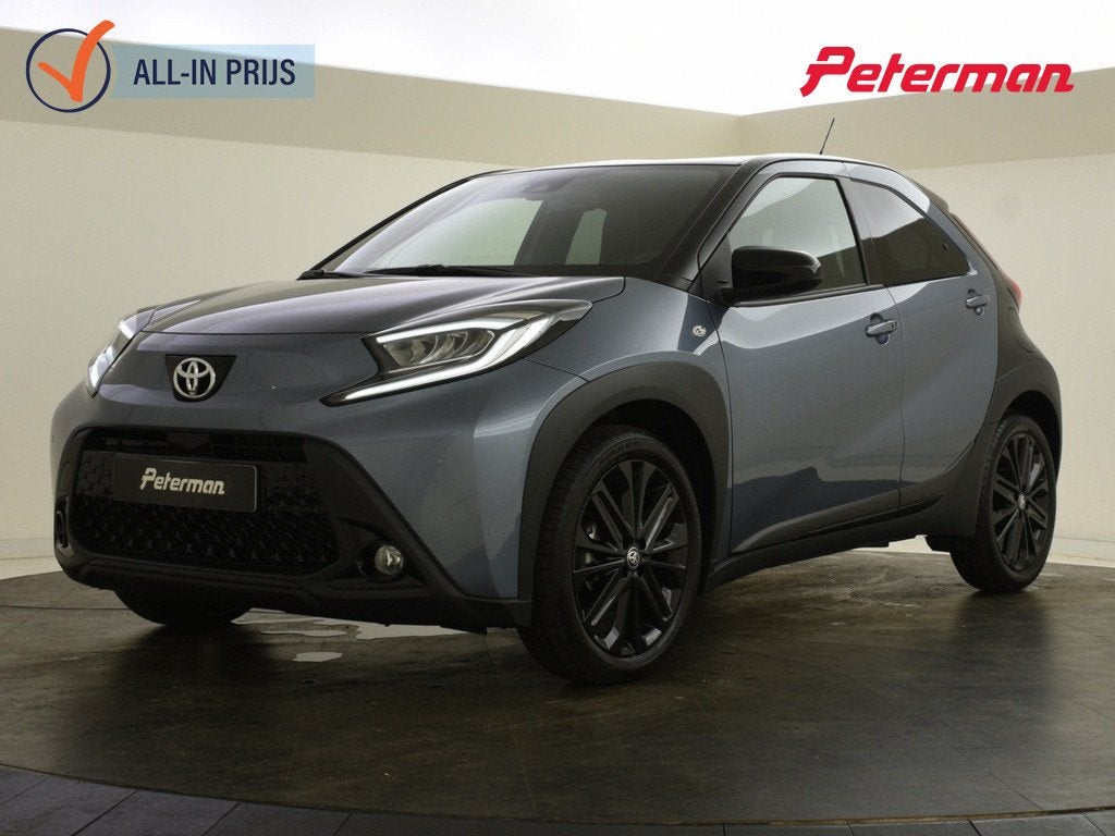 Toyota Aygo X 1.0 VVT-i S-CVT Premium Bi-tone | JBL | Keyles, Auto's, Automaat, Gebruikt, 4 stoelen, Leder en Stof