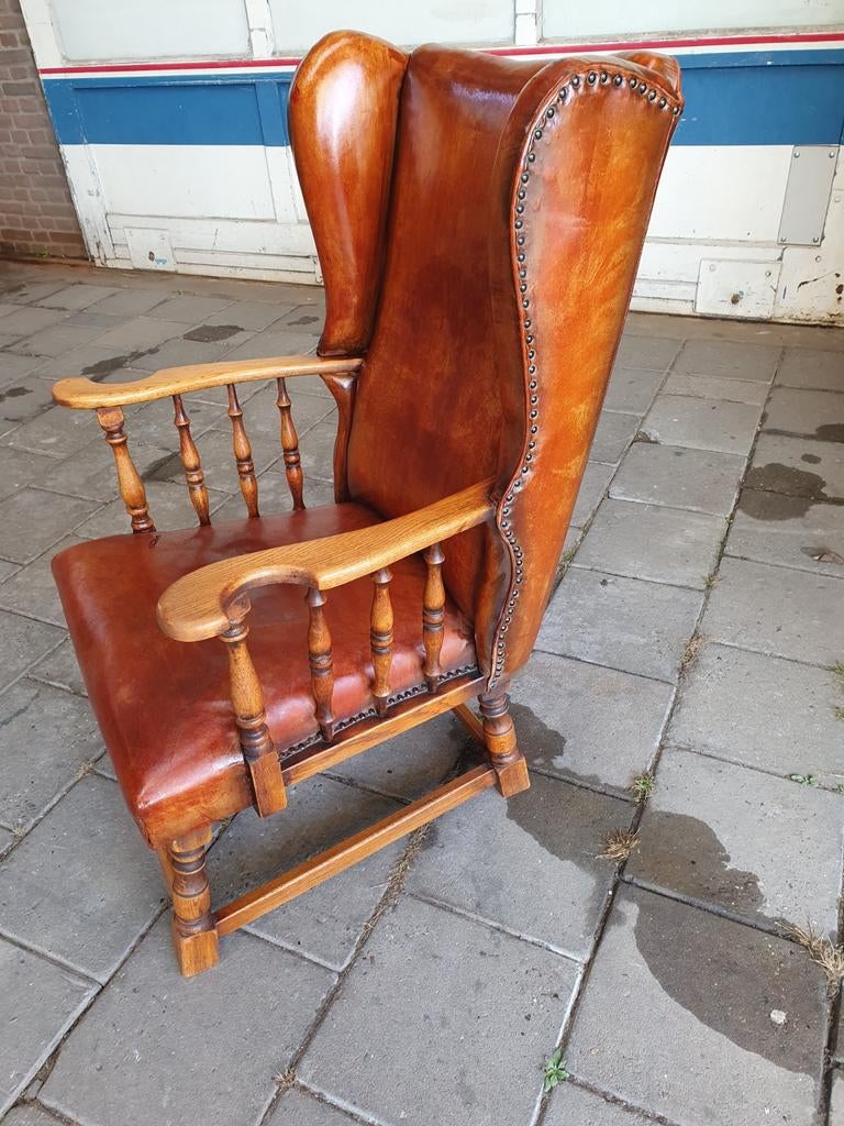 Lederen oorstoel., Ophalen