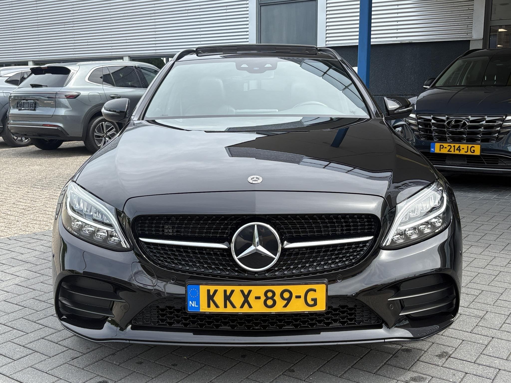 Mercedes-Benz C-klasse Estate 300e T AMG Line | Plug-in Hybr, Auto's, Automaat, 320 pk, Leder en Stof, Zwart
