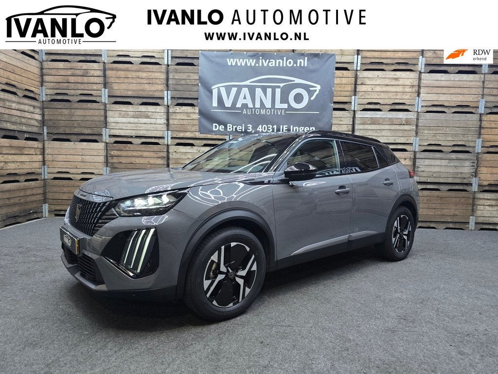 Peugeot E-2008 EV GT 54 kWh Navi LED Clima Cruise Camera LM, Auto's, Peugeot, Gebruikt, Zwart, 156 pk, Leder en Stof