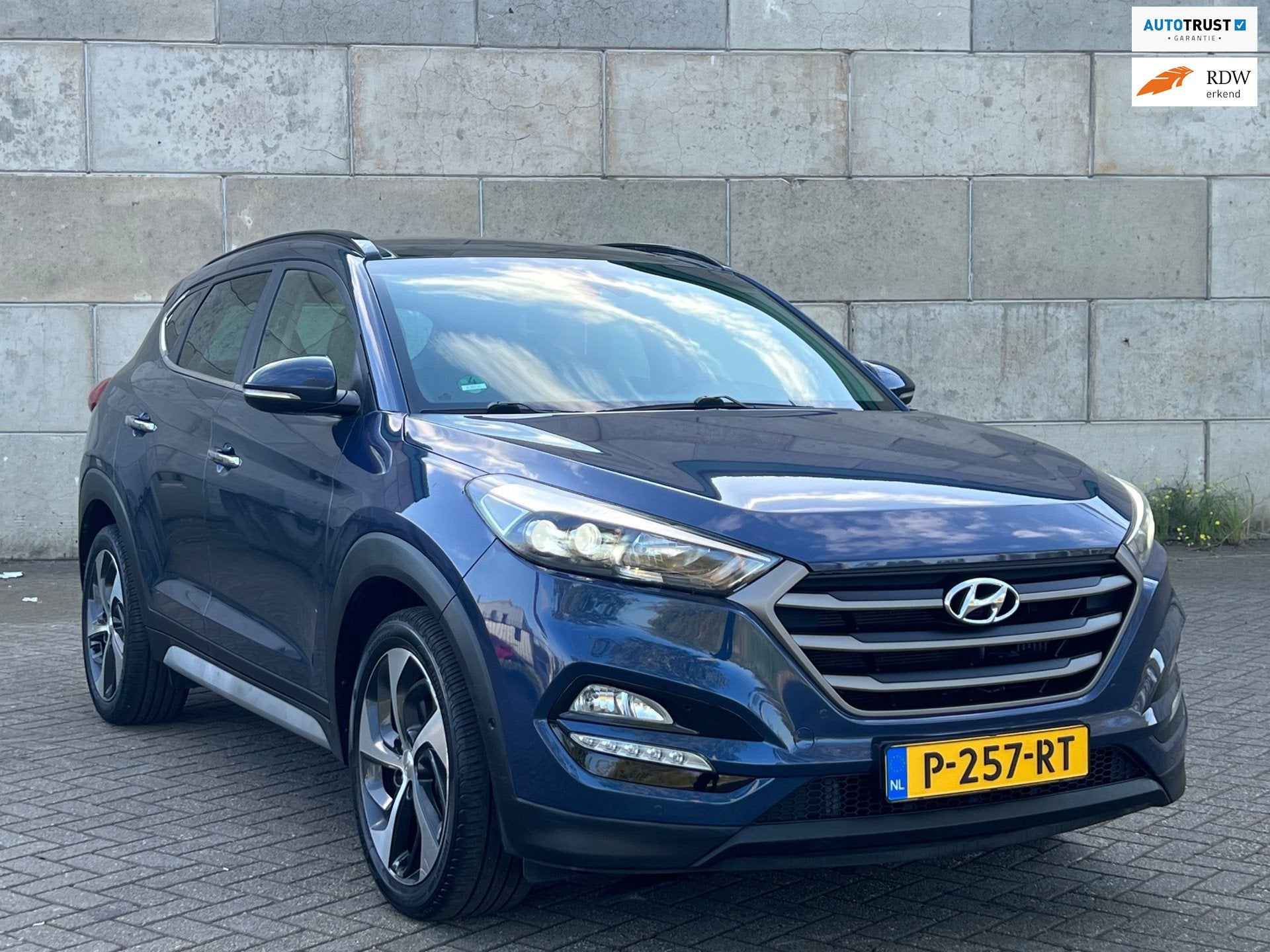 Hyundai Tucson 1.6 T-GDi Premium 4WD panorama dak automaat, Auto's, Dealer onderhouden, Gebruikt, 4 cilinders, Blauw