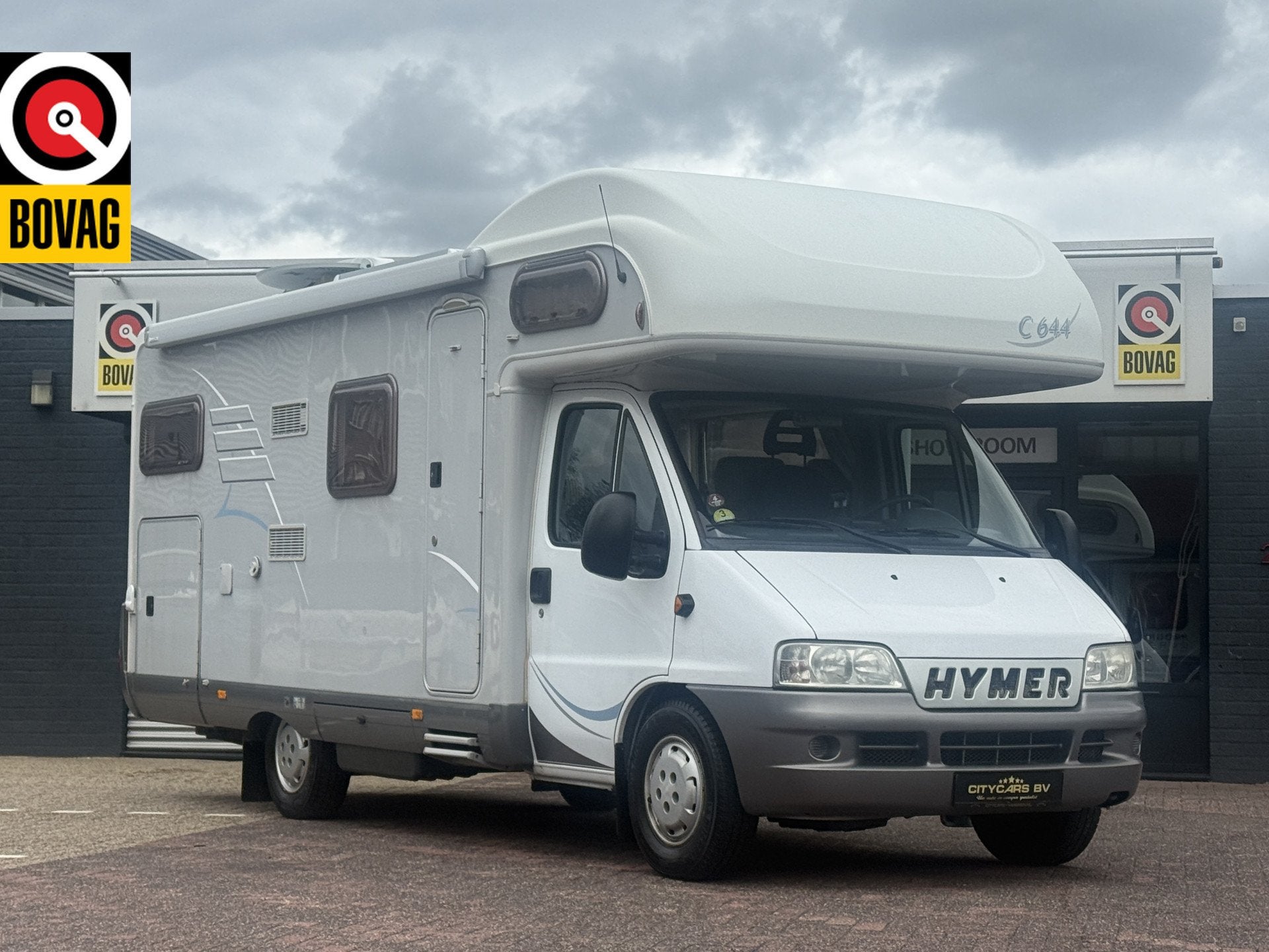 Hymer C 644 alkoof dwarsbed+bovenbed full options in zeer ne, Caravans en Kamperen, Campers, Airbags, Ringverwarming, 6 tot 7 meter