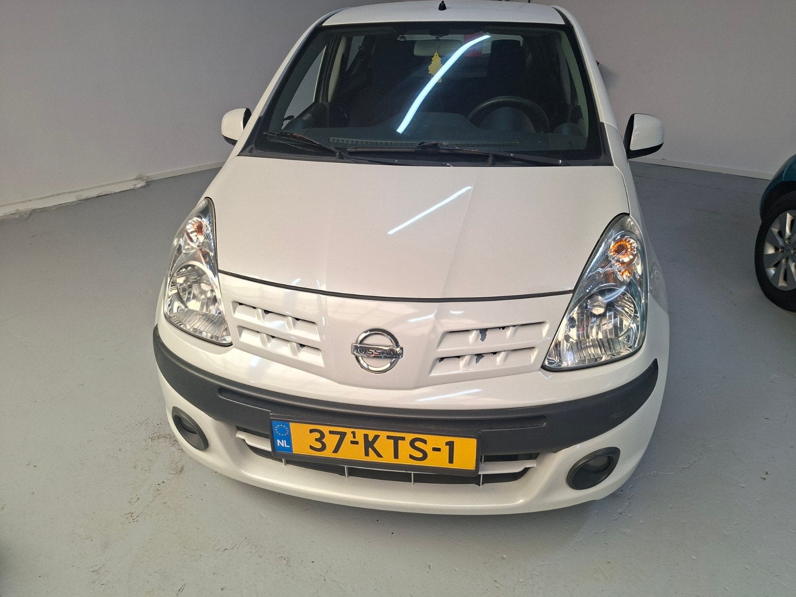 Nissan Pixo 1.0 50KW 5D 2010 Wit, Auto's, Nissan, Voorwielaandrijving, Stof, 4 stoelen, Radio