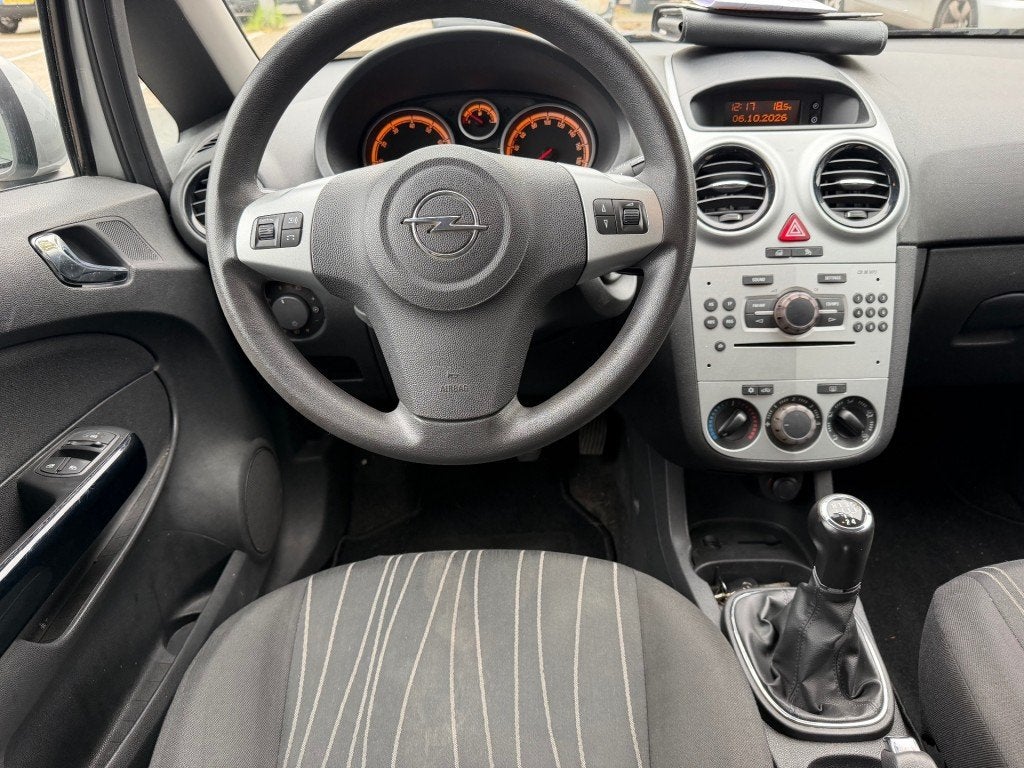 Opel CORSA 1.4-16V Enjoy 2DE EIG. KOUDE AIRCO RIJDT GOED NAP, Auto's, Gebruikt, 4 cilinders, 49 €/maand, Bedrijf