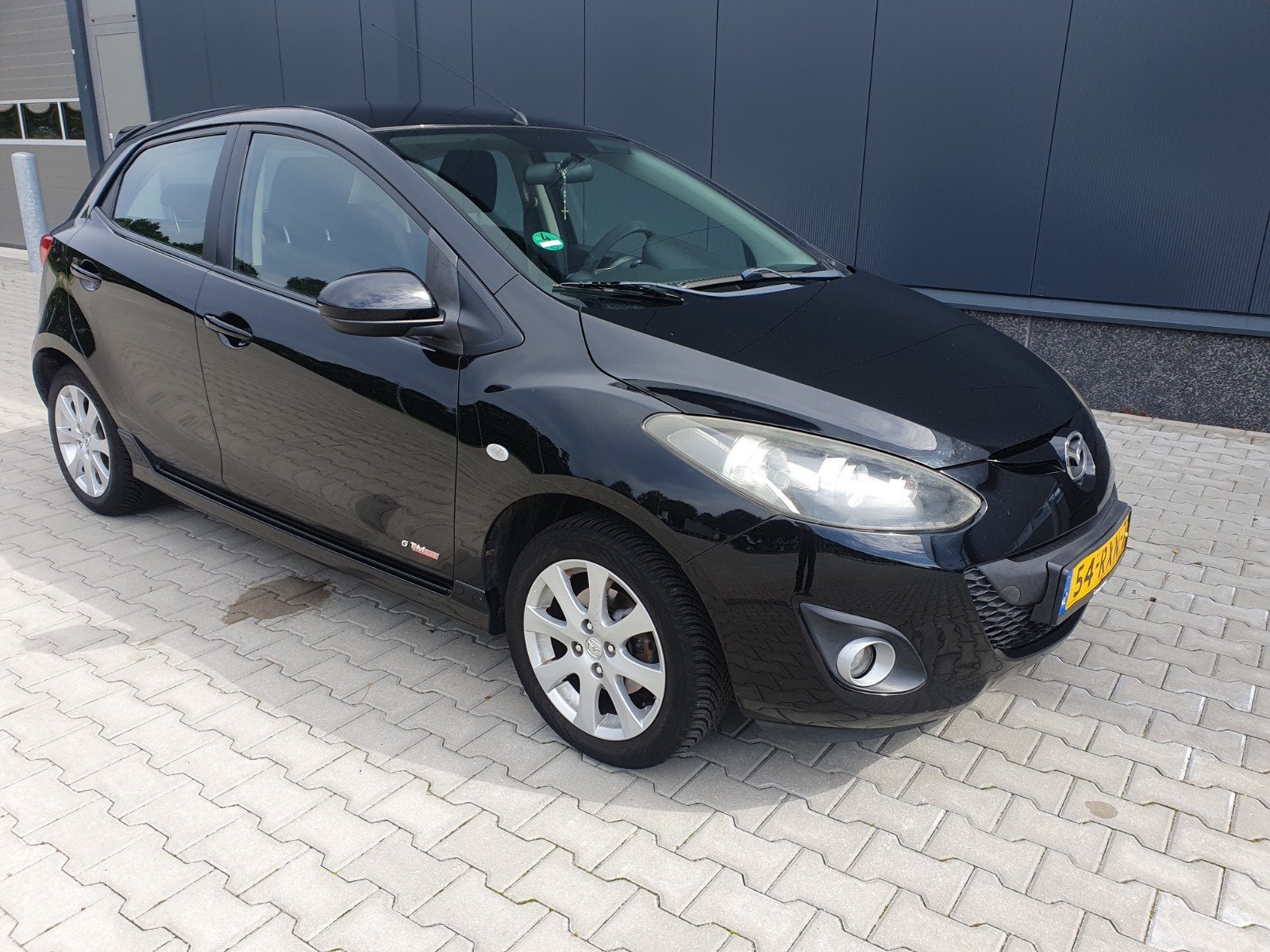 Mazda 2 1.3 Bifuel 62KW 5DRS 2011 Zwart LPG-G3, Voorwielaandrijving, 15 km/l, 37 €/maand, 4 cilinders