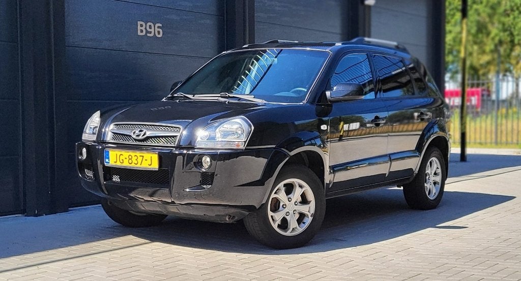 ZEER MOOIE Hyundai Tucson 2.0i 2WD | 2009 | 100.489 km, Auto's, Elektrische ramen, 4 cilinders, Zwart, Leder