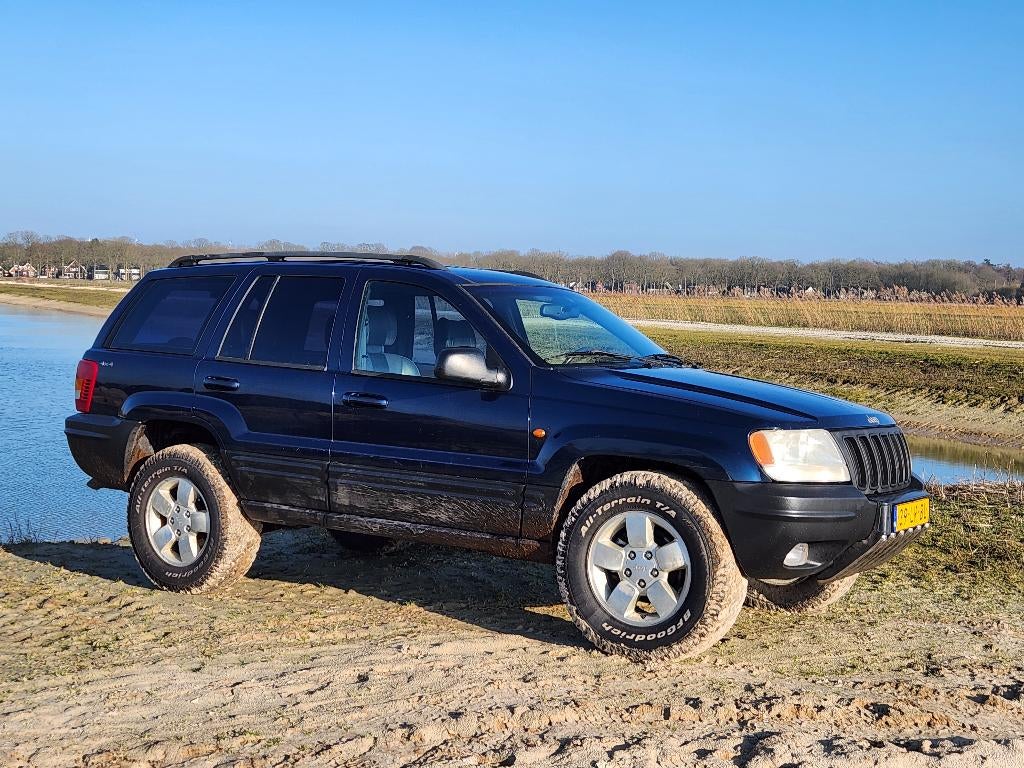 Jeep Grand Cherokee 4.7 I V8 Limited AUT 2003 Blauw, Auto's, Jeep, Automaat, 1826 kg, Blauw, 4701 cc