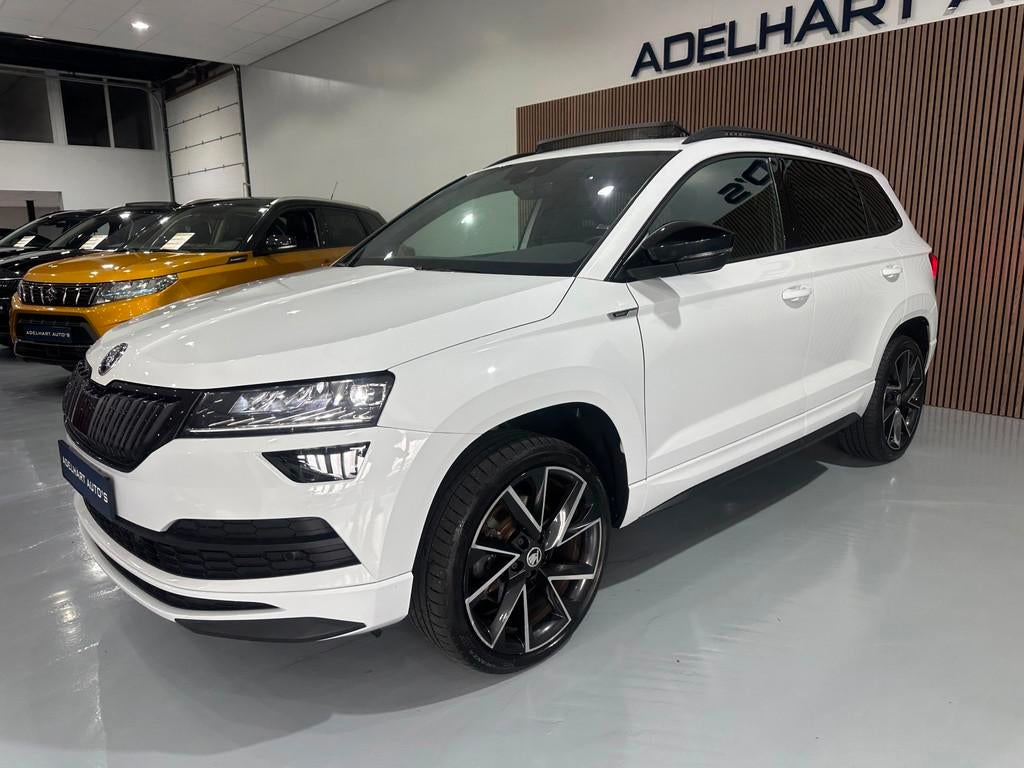 Skoda Karoq 1.5 TSI ACT Sportline Automaat / Panorama dak /, 1295 kg, 4 cilinders, 150 pk, Wit