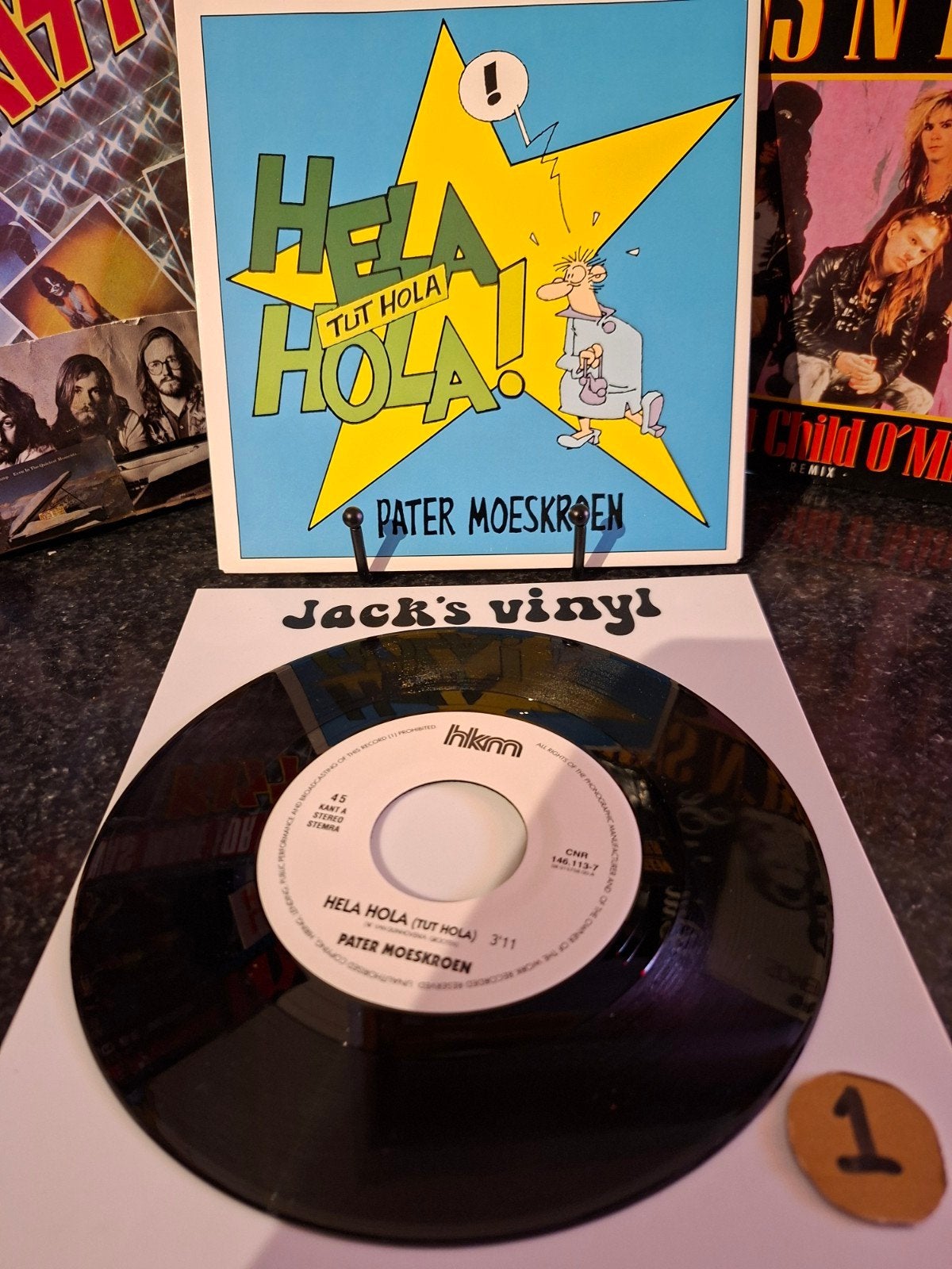 Pater Moeskroen - Hela Hola (Tut Hola) 7 inch single 1992/1, Ophalen of Verzenden, Zo goed als nieuw, 7 inch, Overige typen