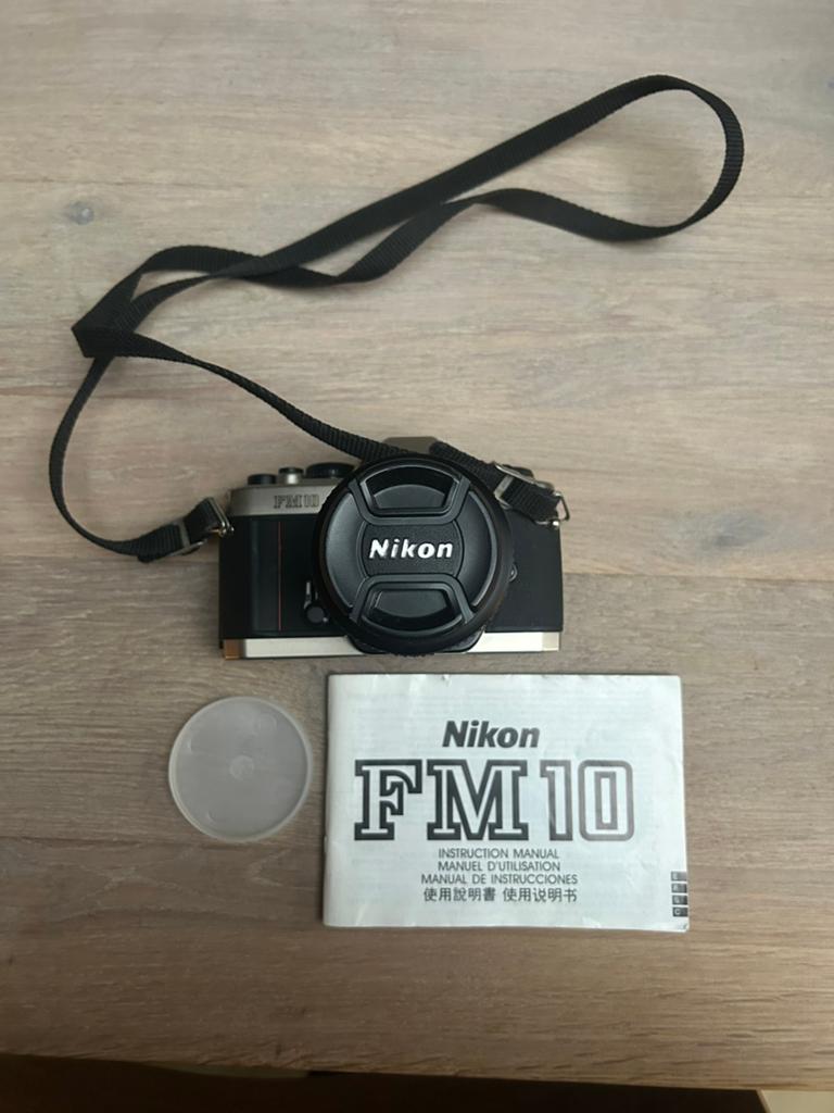 Nikon FM10 analoge 35mm camera + 35-70mm lens + handleiding, Ophalen of Verzenden, Zo goed als nieuw, Spiegelreflex, Nikon
