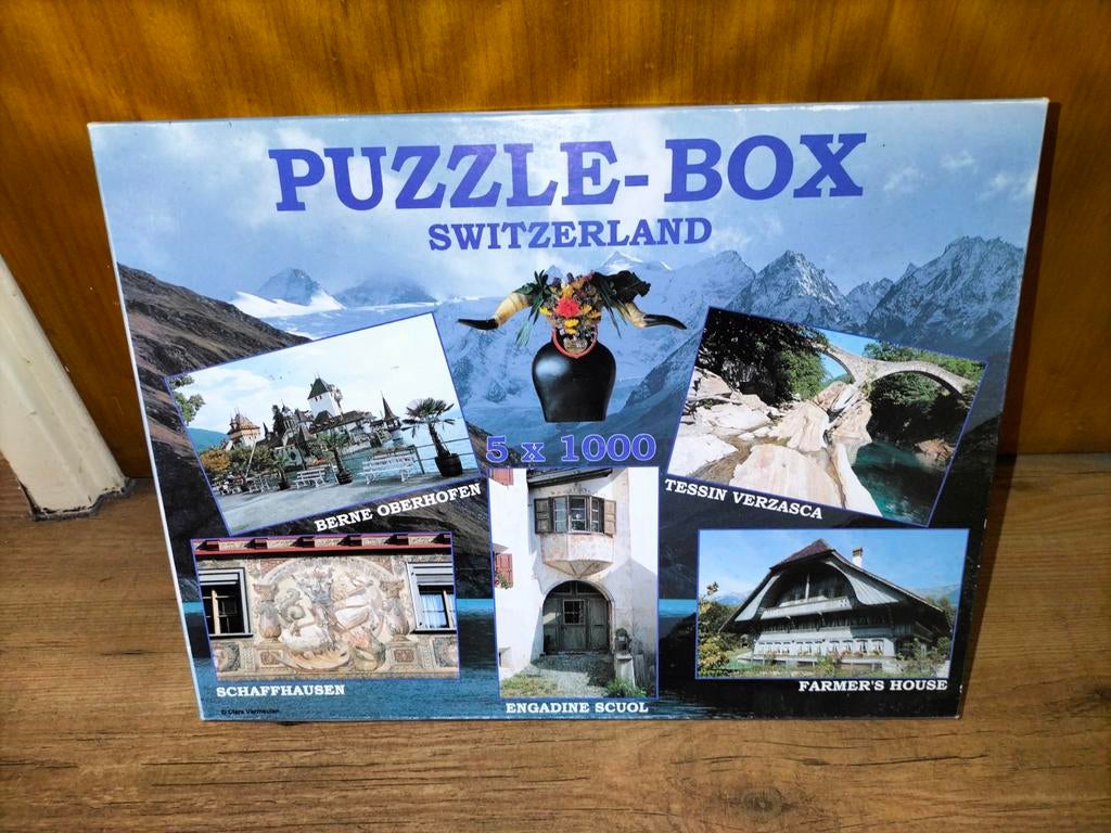 Doos met 4 nieuwe en 1 gebruikte puzzel Zwitserland, €15,-, Ophalen of Verzenden, 500 t/m 1500 stukjes, Gebruikt, Legpuzzel