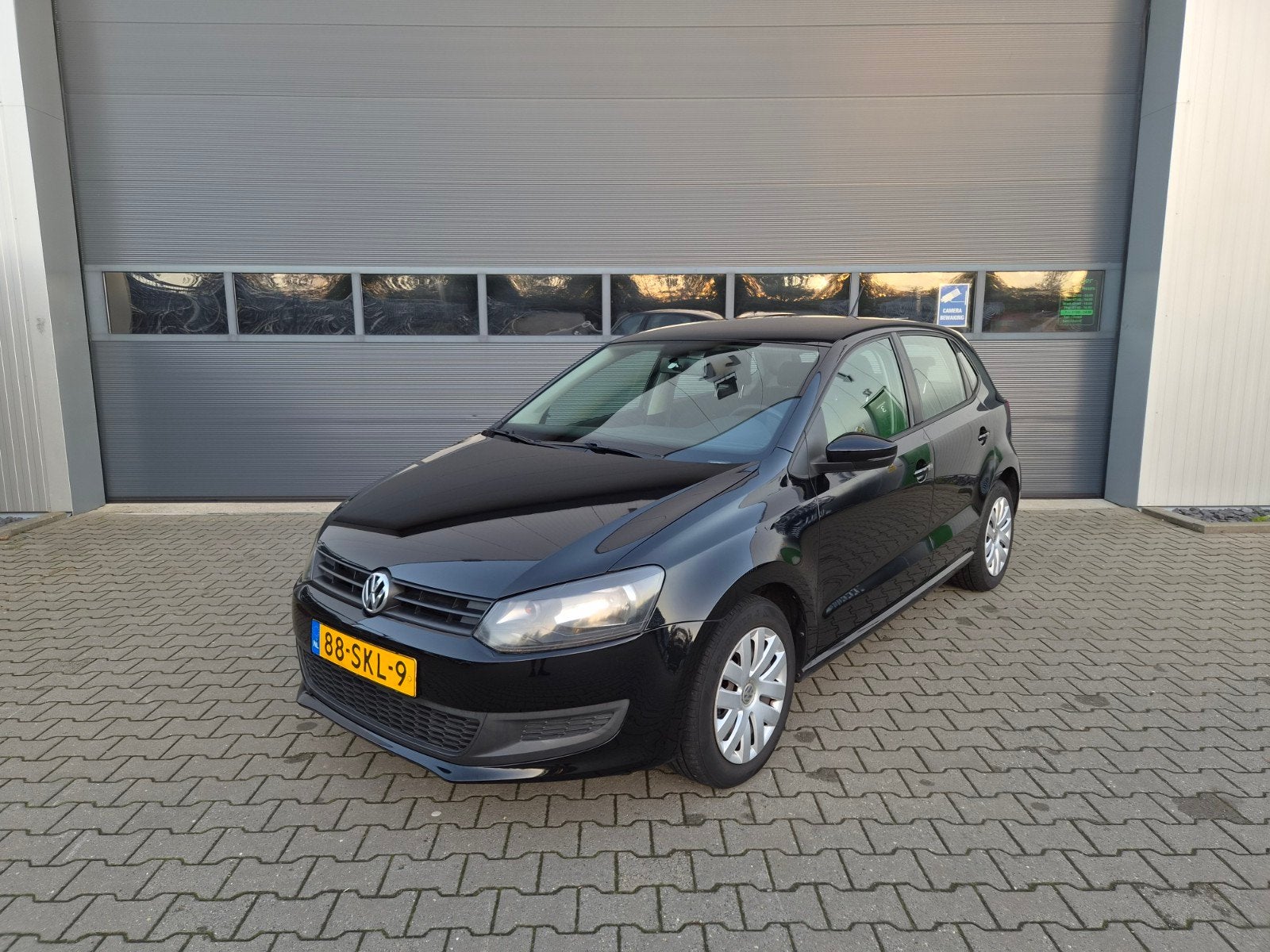 Volkswagen Polo 1.2 5D 2011 Zwart l Orig NL l Nap l 2e eige, Voorwielaandrijving, 40 €/maand, 1198 cc, Zwart