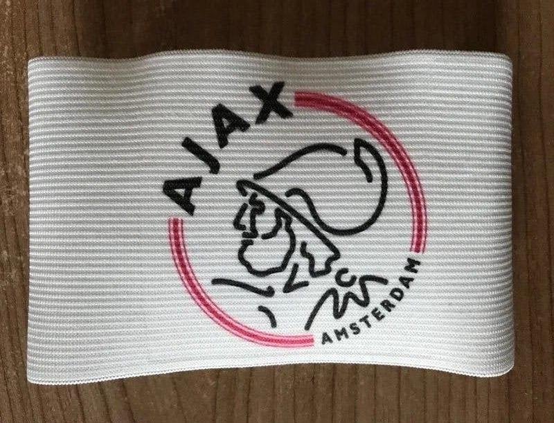 Ajax aanvoerdersband, Sport en Fitness, Voetbal, Maat XS of kleiner, Verzenden, Nieuw, Clubaccessoires