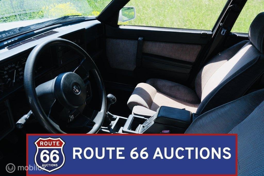 Alfa Romeo 75 | 1986 | Route 66 Auctions, Auto's, Oldtimers, Overige carrosserieën, Zwart, Bedrijf, Handgeschakeld