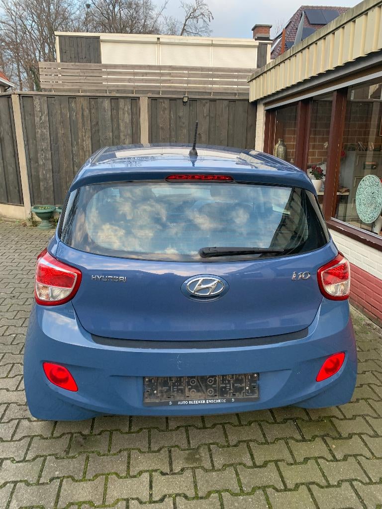 HYUNDAI  i10 1.0i 66pk 2016 Blauw, Auto's, Voorwielaandrijving, Stof, 31 €/maand, 23 km/l