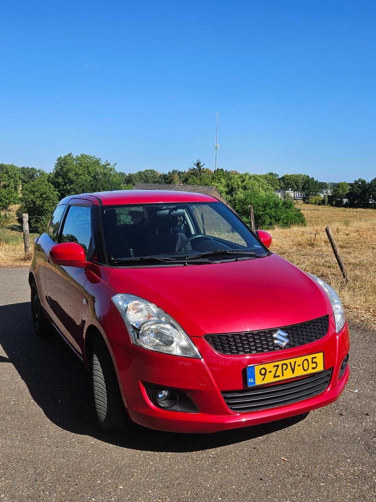 Suzuki Swift 1.2 - 3 Deurs - 2012 - Rood, Voorwielaandrijving, Stof, Swift, Handgeschakeld