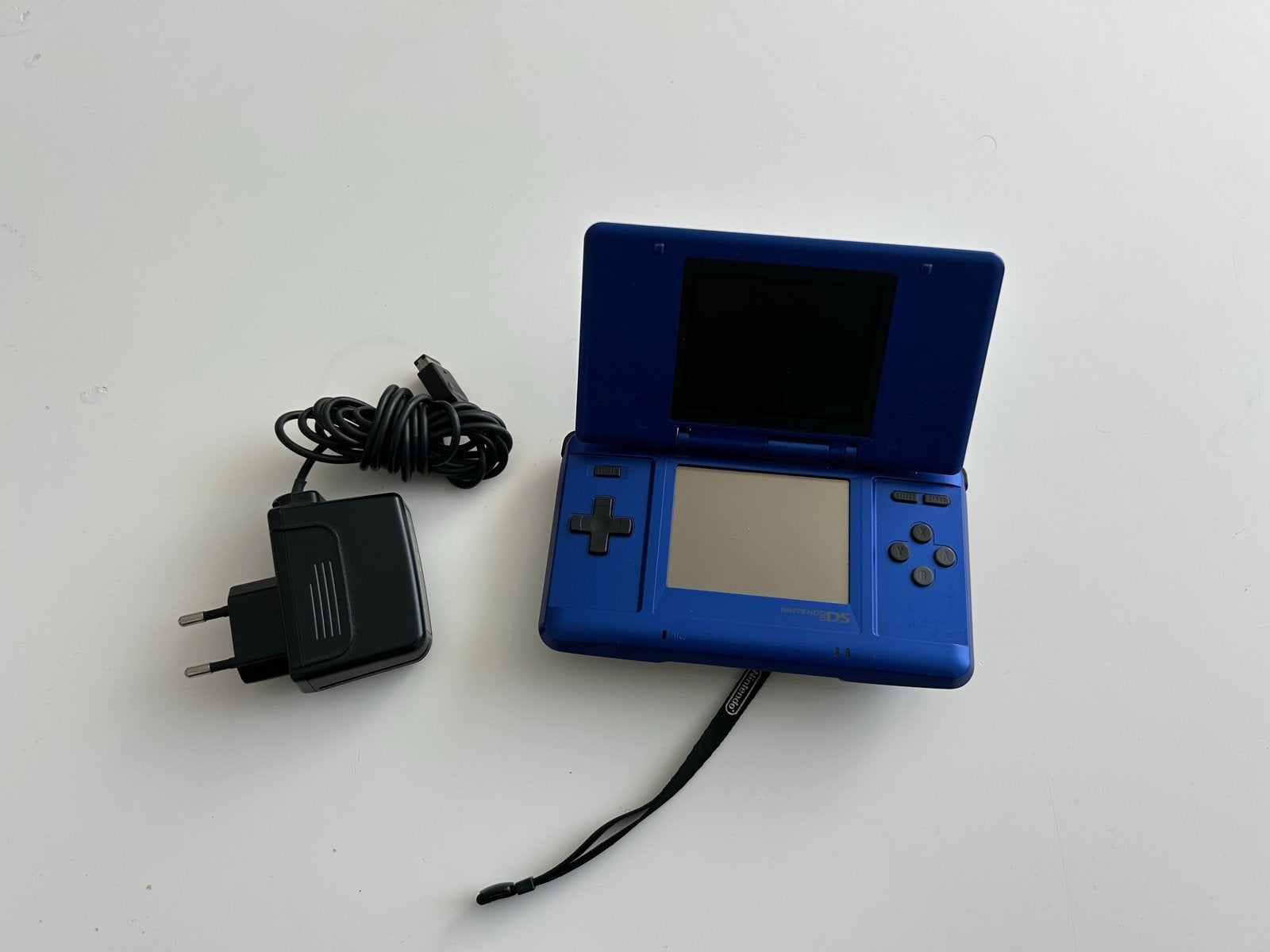Blauwe Nintendo DS Phat  met oplader, Ophalen of Verzenden, Zo goed als nieuw, Blauw, DS Lite