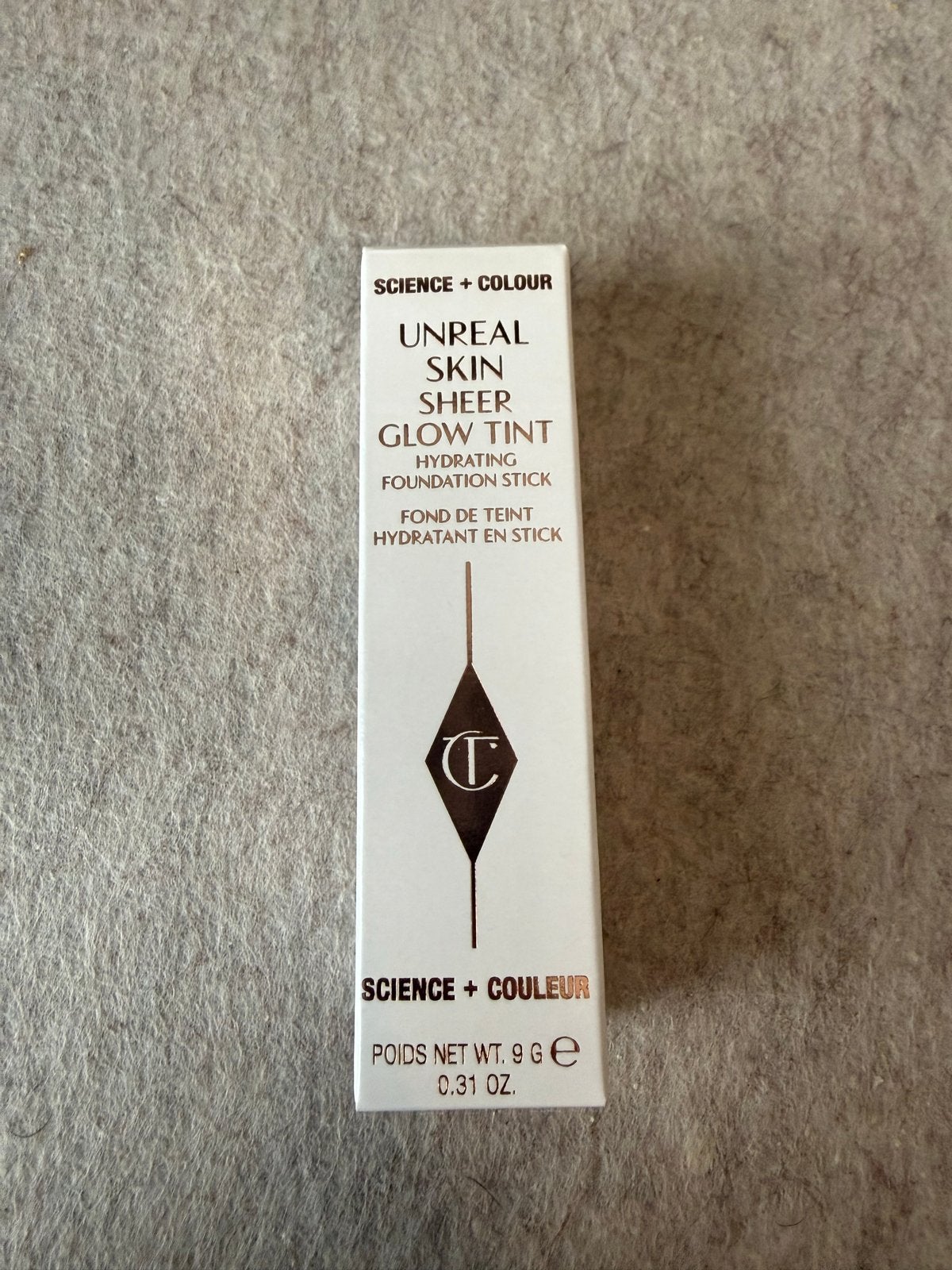 Charlotte Tilbury Unreal Skin Sheer Glow Tint 2 Fair, Beige, Zo goed als nieuw, Make-up, Verzenden