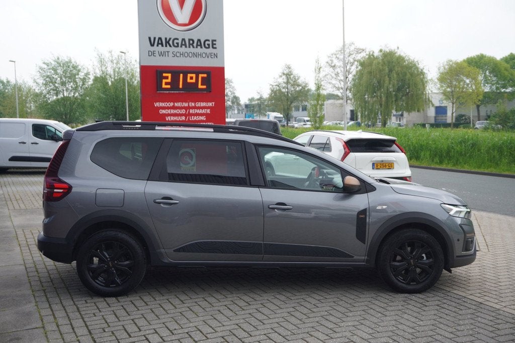 Dacia Jogger 1.6 Hybrid 140 Extreme 5p / Carplay / Camera /, Auto's, Dacia, Stof, Grijs, Hybride Elektrisch/Benzine, Jogger