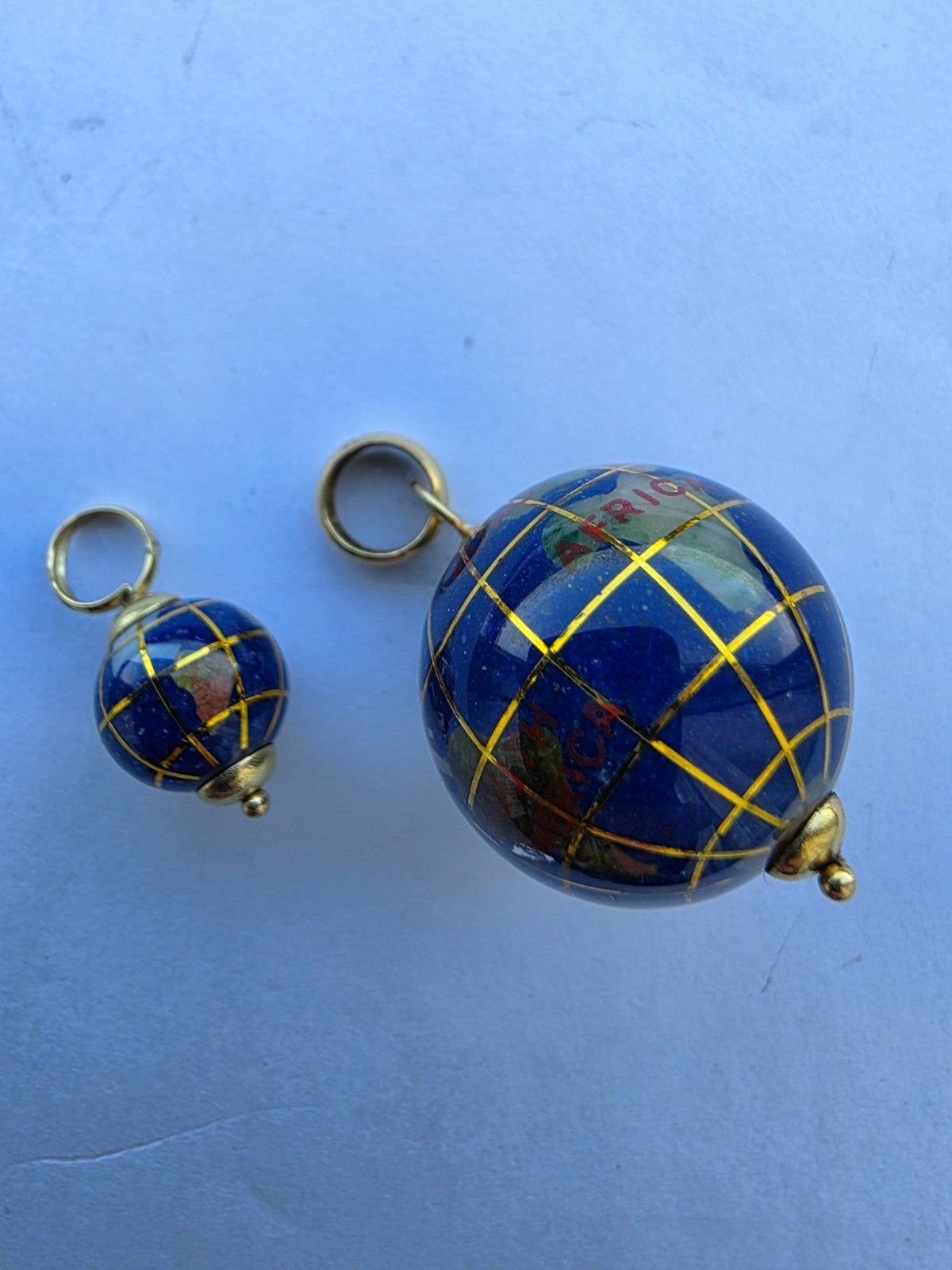 Setje 18 karaat gouden wereldbollen, Ophalen, Goud