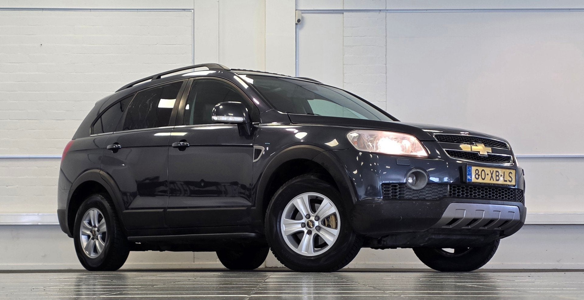 Chevrolet Captiva 2.4i Executive 7p Leder Trekhaak APK 18-07, Auto's, Chevrolet, 136 pk, Gebruikt, Zwart, 7 stoelen