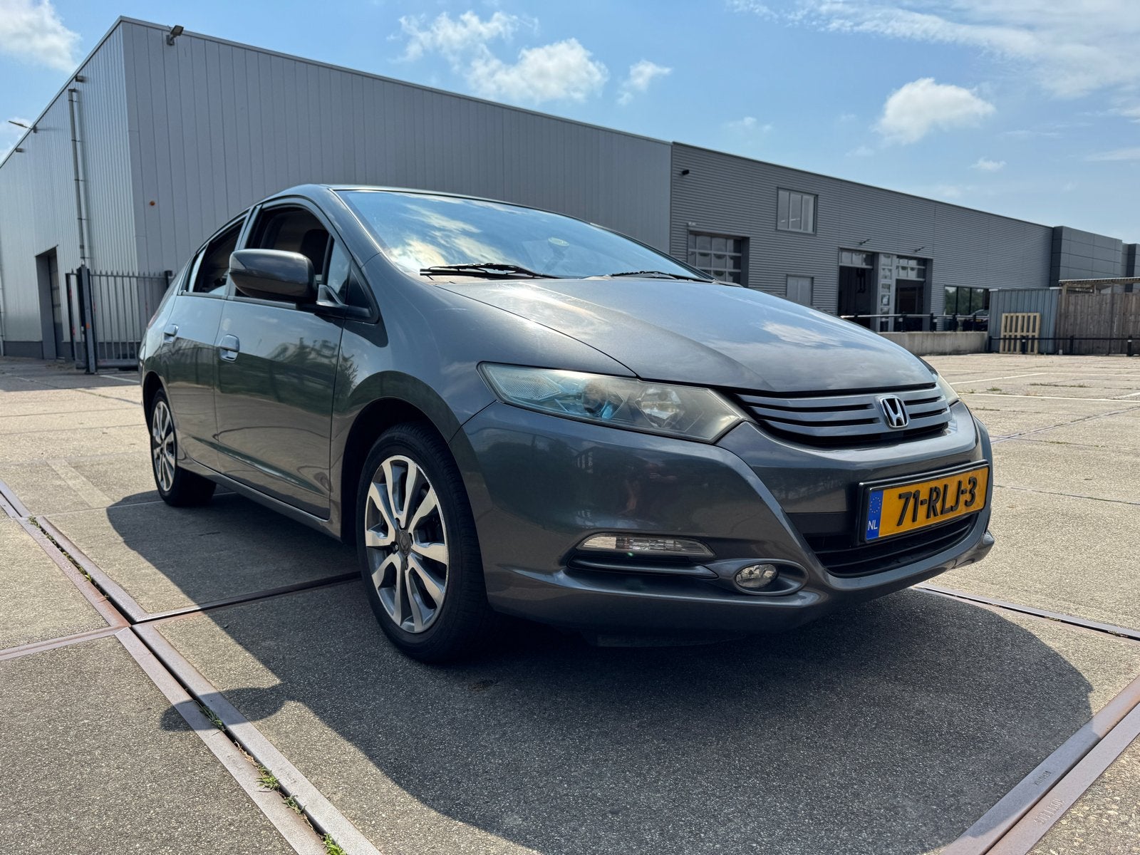 Honda Insight 1.3 Hybrid AUT 2011 Grijs, Auto's, Honda, 4 cilinders, 22 km/l, Zilver of Grijs, Te koop