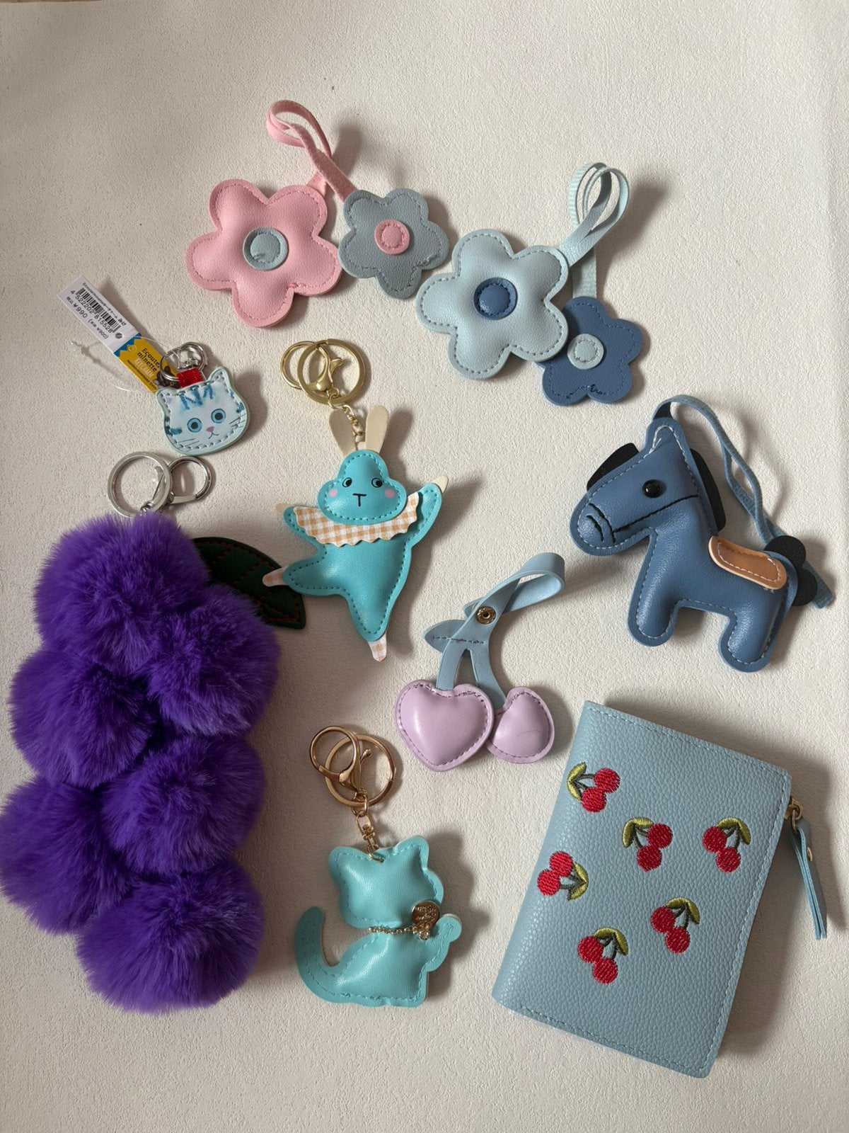 8 tasbedels / sleutelhangers en een kleine portemonnee, Verzenden, Zo goed als nieuw, Blauw, Overige merken