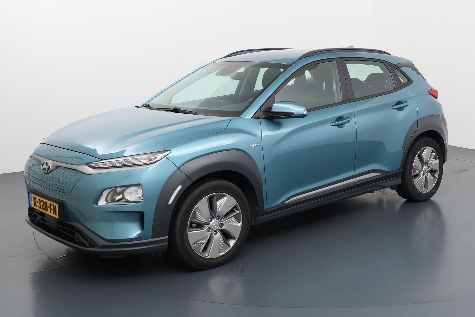 Hyundai Kona EV Comfort 64 kWh Volledig elektrisch en boorde, Auto's, Stof, Gebruikt, Blauw, Origineel Nederlands