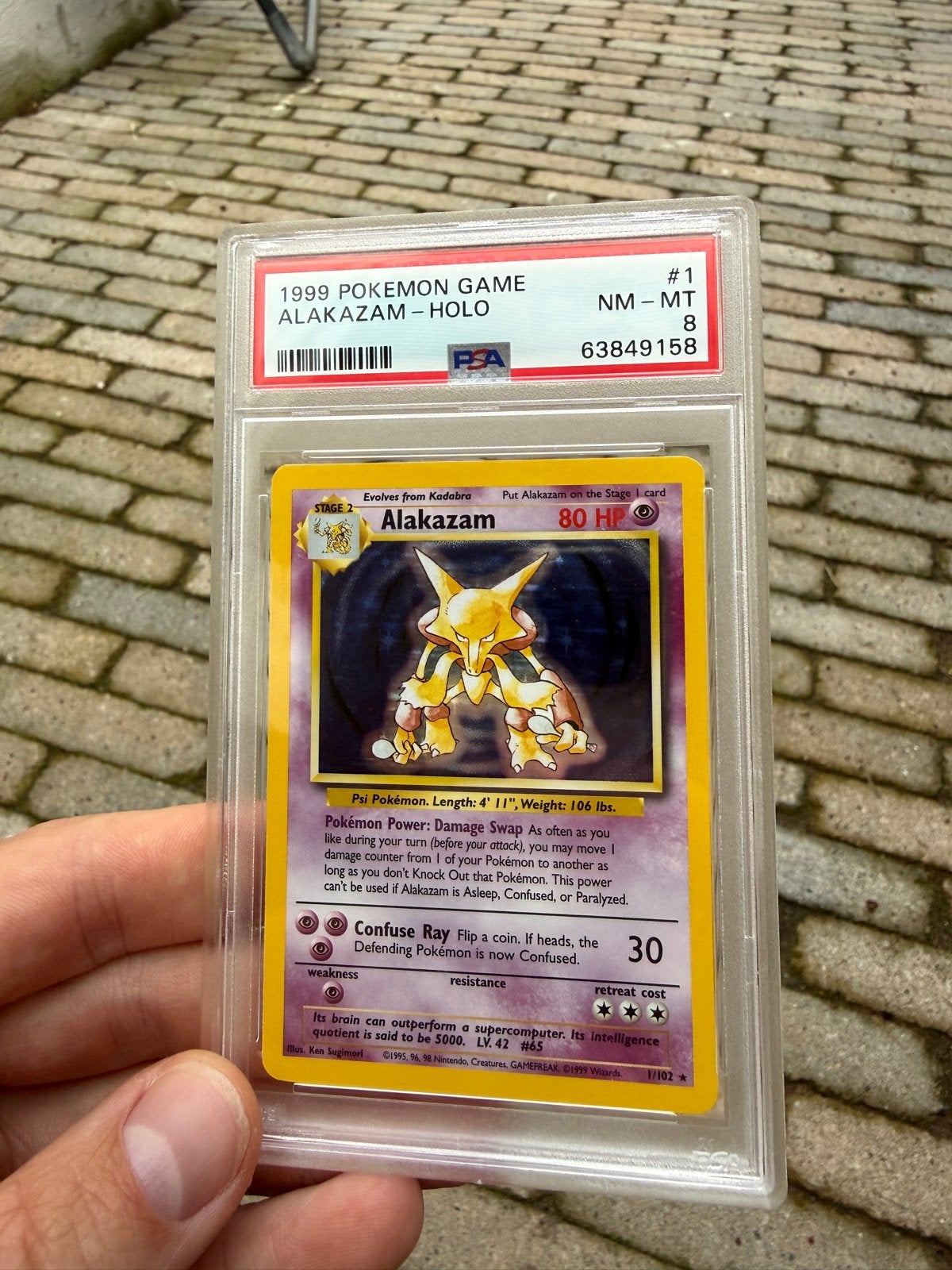 1999 Pokémon Game Alakazam Holo PSA 8 NM-MT, Ophalen, Zo goed als nieuw, Losse kaart, Foil