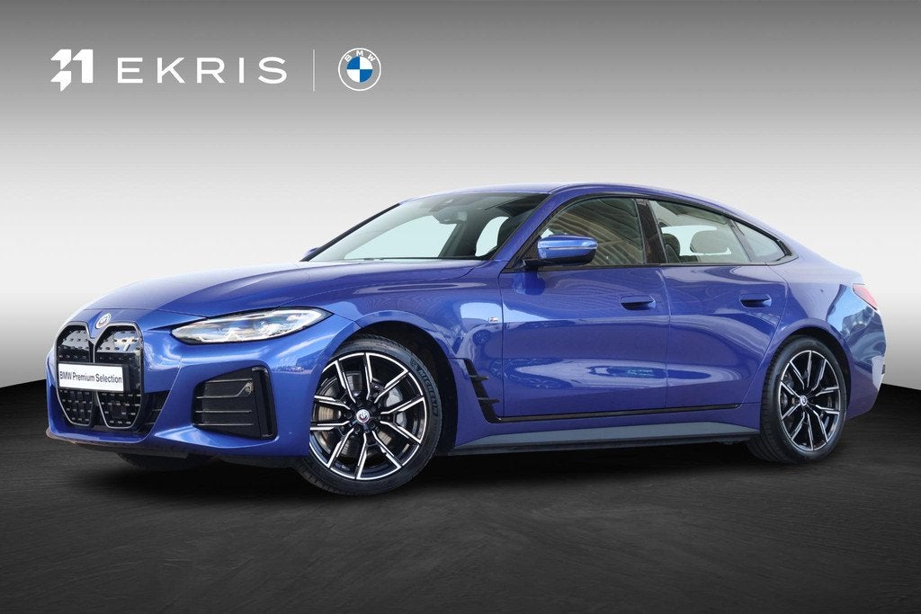 BMW i4 eDrive40 84 kWh | SoH 99% | M-SPort Pakket | Stoel &, Auto's, BMW, Met garantie (alle), Blauw, 340 pk, Origineel Nederlands