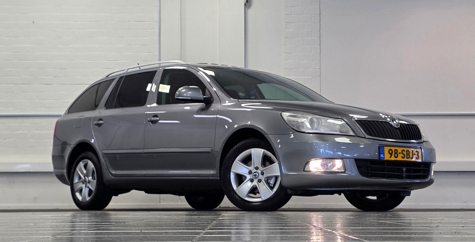 Skoda Octavia Combi 1.4 TSI Elegance Automaat Schuif/kanteld, Auto's, Euro 5, Stof, Gebruikt, Zwart
