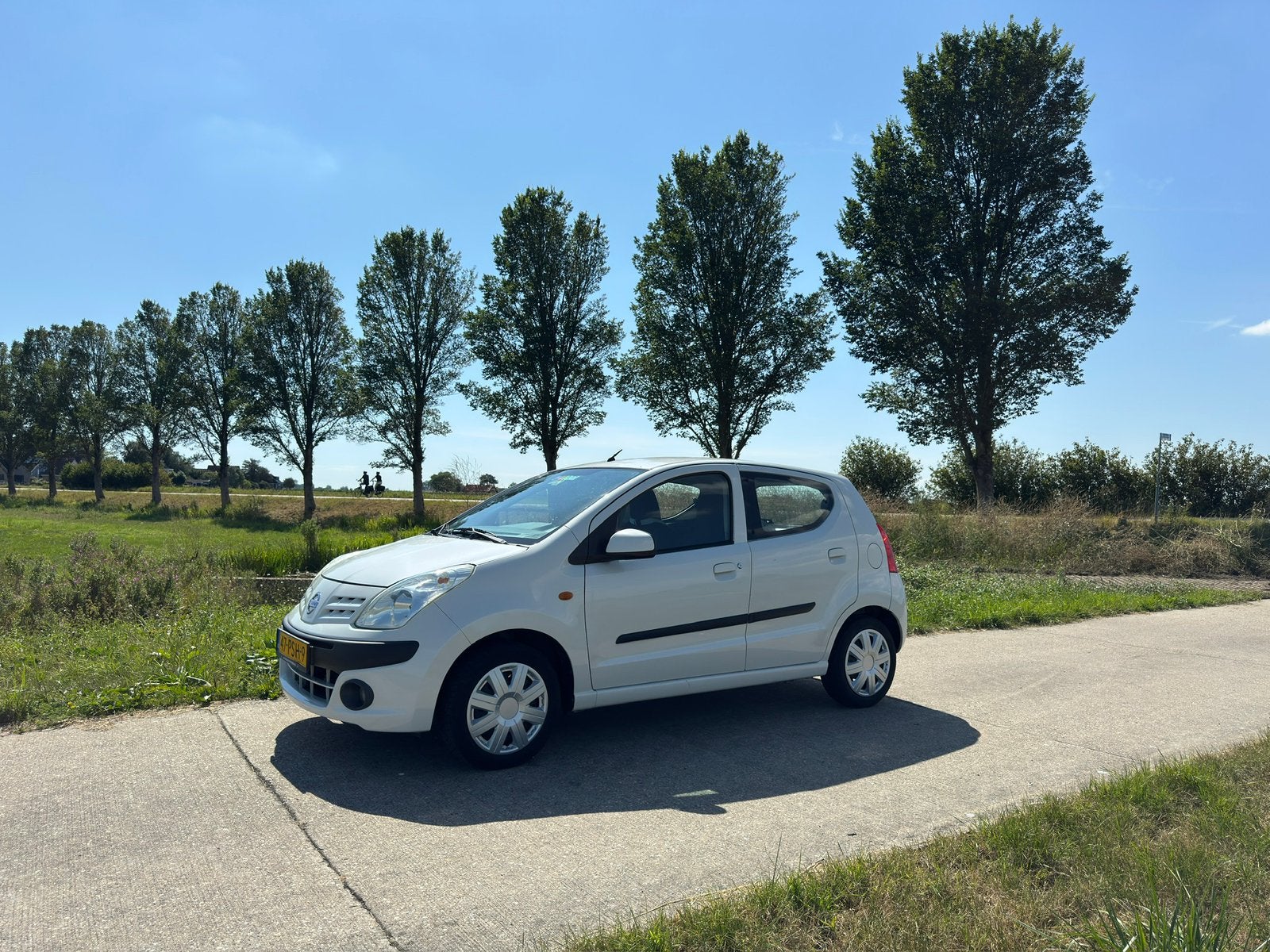 Nissan Pixo 1.0 50KW 5D 2011 Wit, Auto's, Voorwielaandrijving, Euro 5, Stof, 4 stoelen