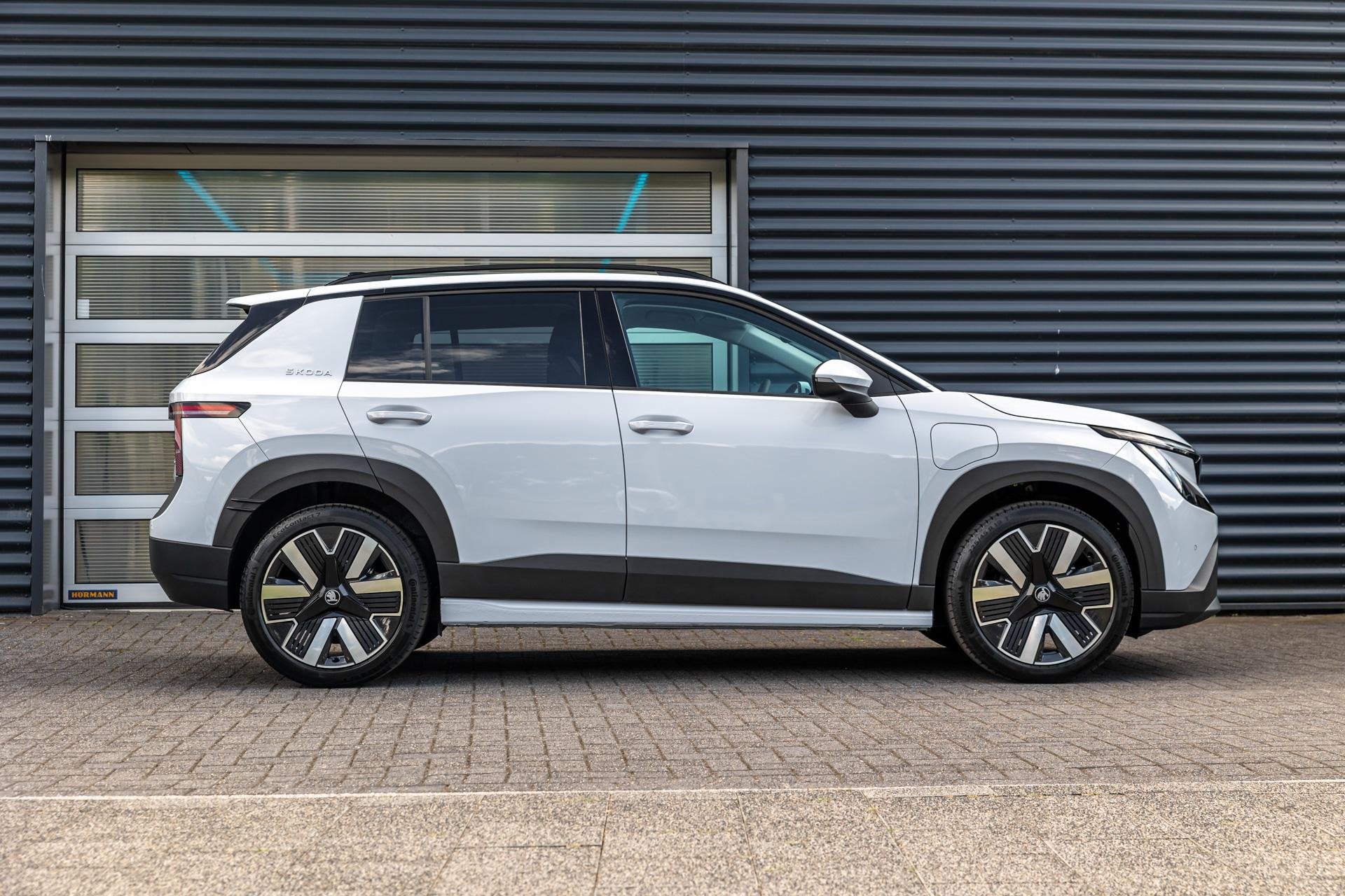 Skoda Epiq Hero 211pk 56 kWh | Velgen 19'' | Achteruitrijcam, Auto's, Skoda, 12 maanden, Overige modellen, Wit, 56 kWh