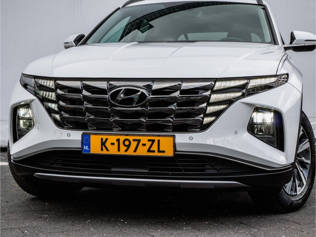 Hyundai Tucson 1.6 T-GDI 180pk Aut. HEV Comfort Trekhaak/ Ca, Auto's, Stof, Gebruikt, 4 cilinders, Met garantie (alle)