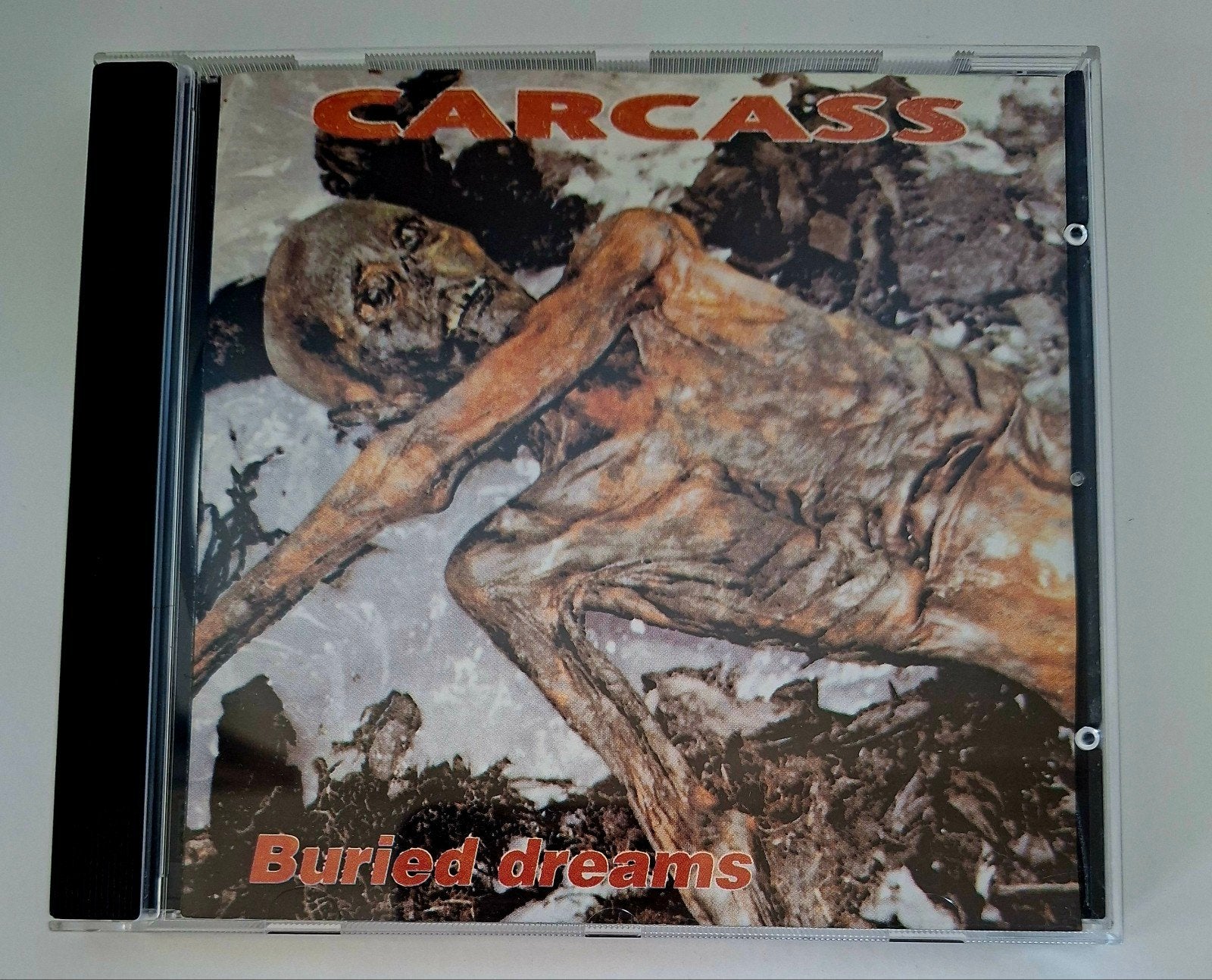 Carcass – Buried Dreams, Ophalen of Verzenden, Zo goed als nieuw