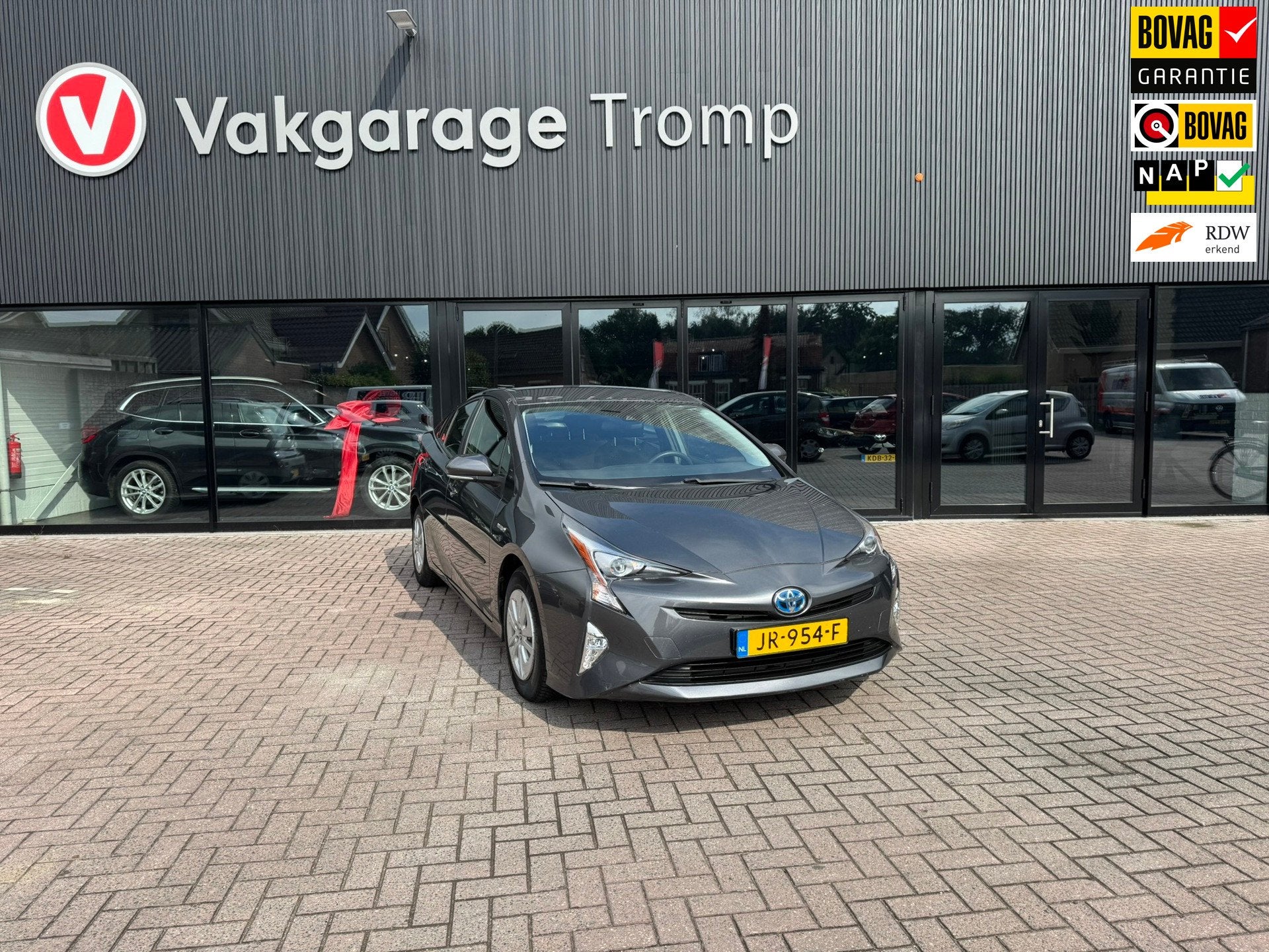 Toyota Prius 1.8 Aspiration, Stof, Met garantie (alle), Bedrijf, Hybride Elektrisch/Benzine