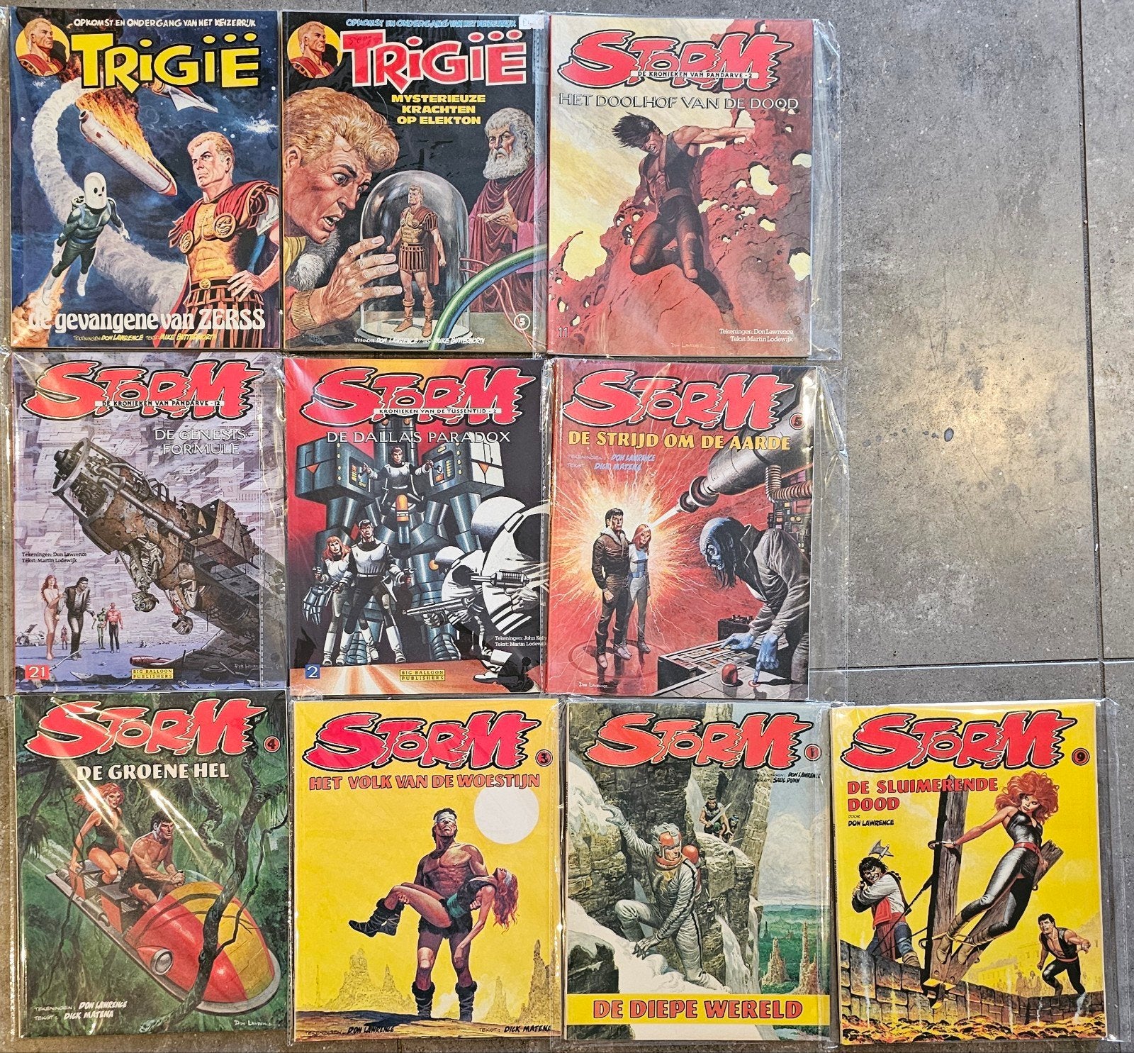 10 stuks storm en Trigie stripboeken - Perfecte staat, Meerdere stripboeken, Ophalen of Verzenden, Zo goed als nieuw, Don Lawrence