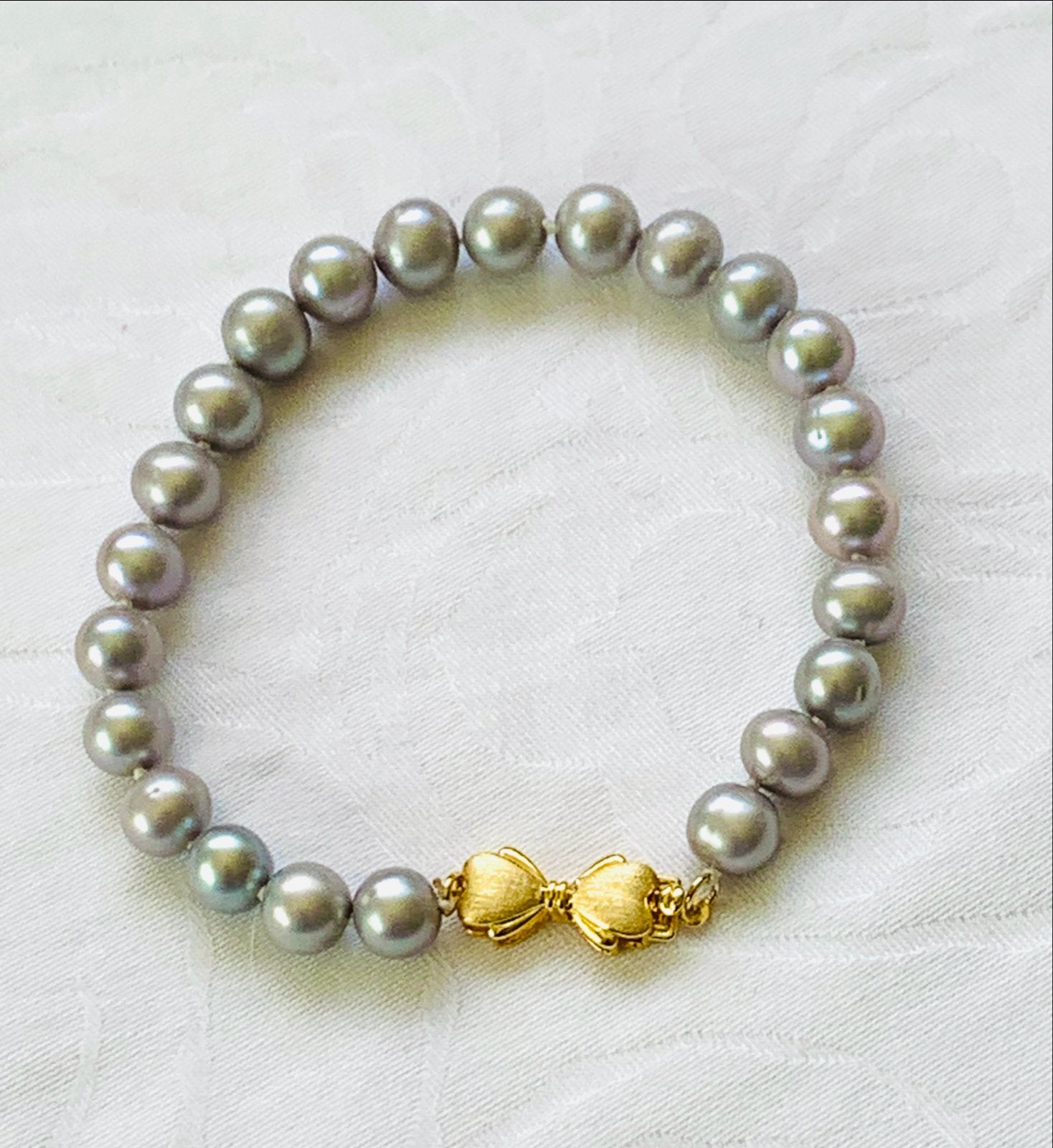 Parel armband met Akoya parels en 14K strikjes slot, Nieuw, Ophalen of Verzenden, Grijs, Met bedels of kralen