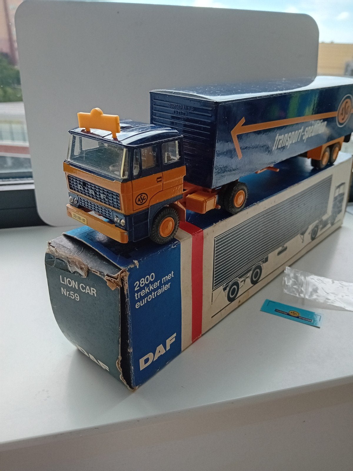 Daf 2800 Trekker met oplegger ASG., Hobby en Vrije tijd, Modelauto's | 1:50, Ophalen of Verzenden, Bus of Vrachtwagen, Lion Toys